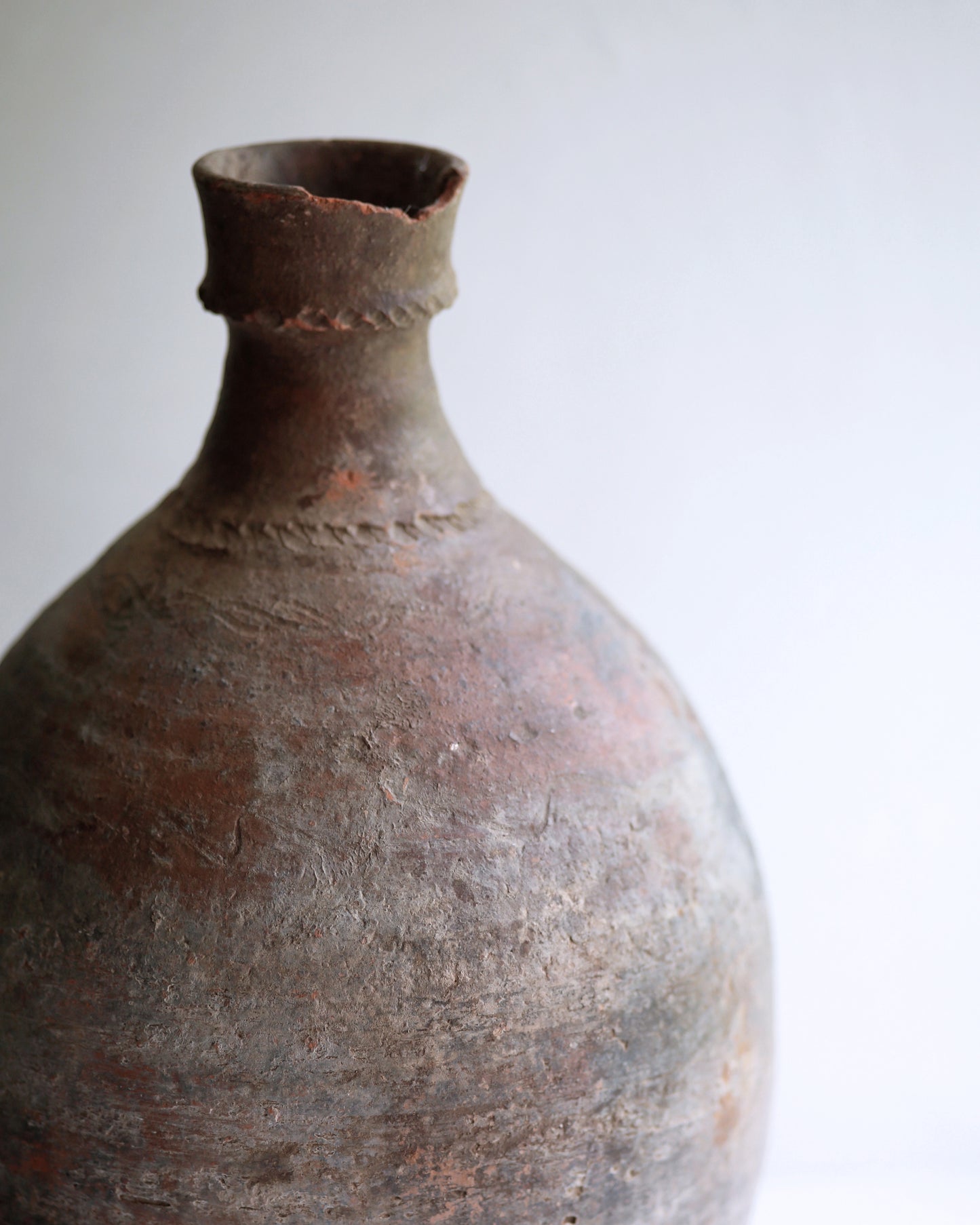 Close up of artisan hand ribbed detail on neck of Turkish amphora pot