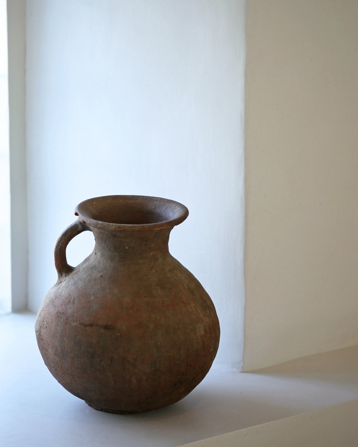 flared rim of antique water jug originating from Turkey