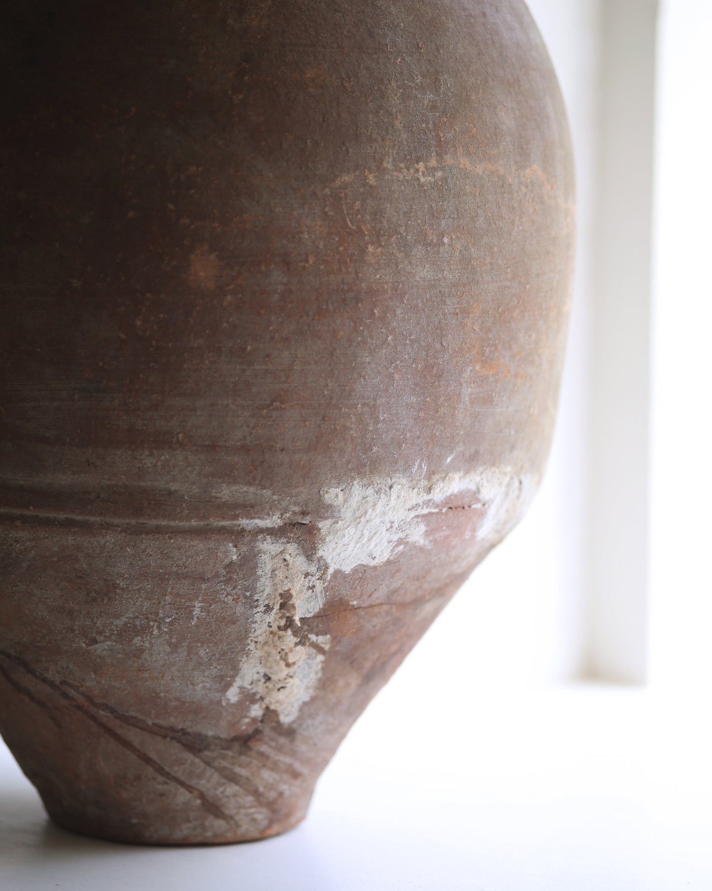 Old repair to base of pot