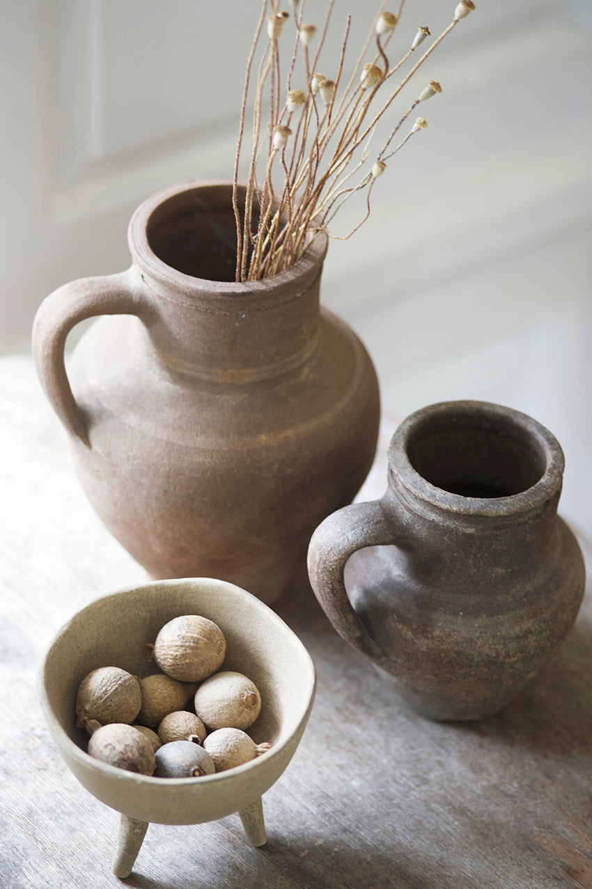 Antique table with small antique Turkish pots + rustic natural styling