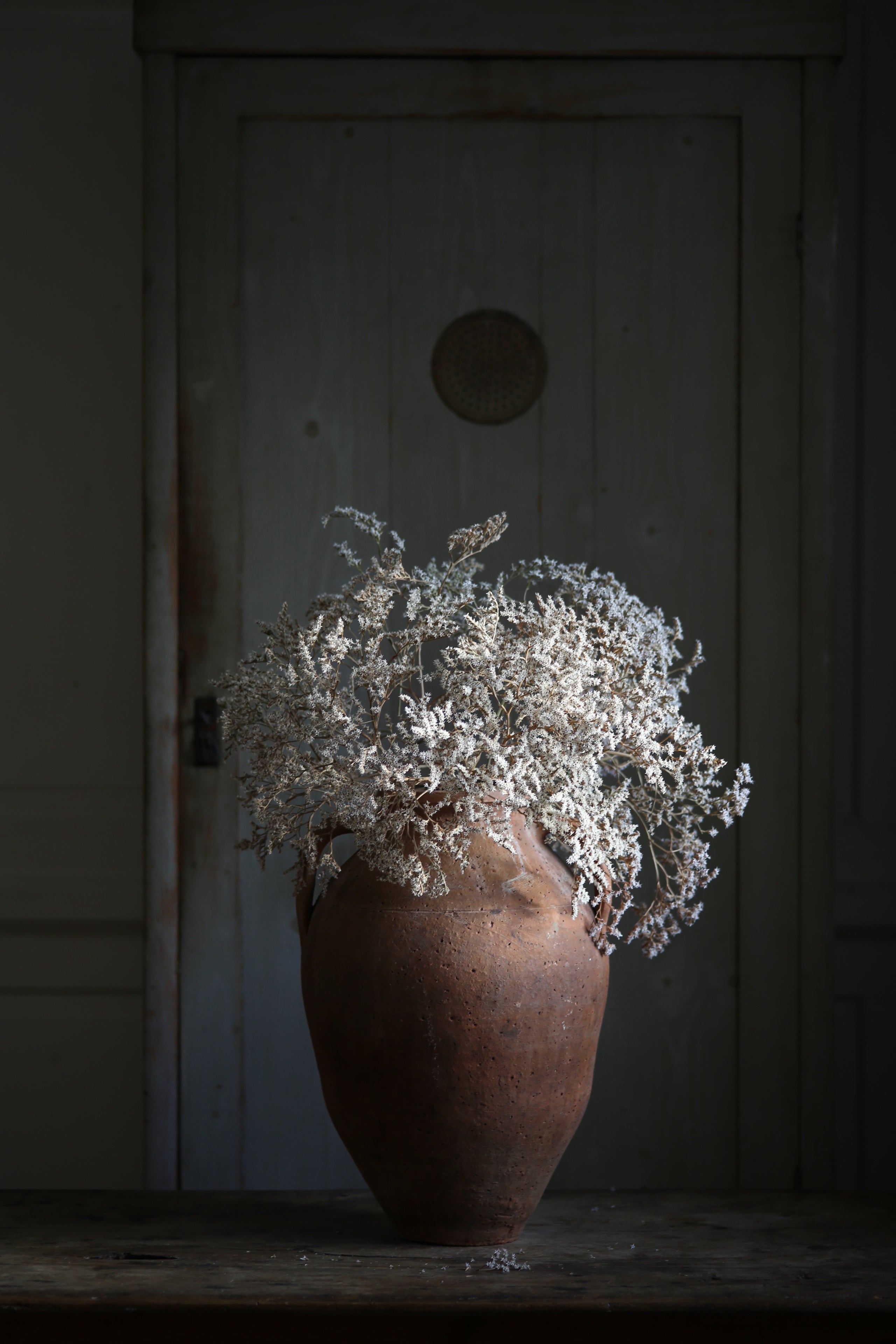 Statement table centrepiece rustic Antique vase styled with delicate dried flowers