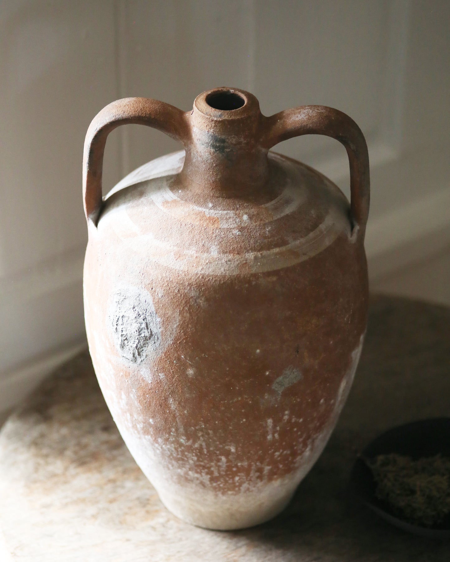 Characterful detail of repair to antique pot