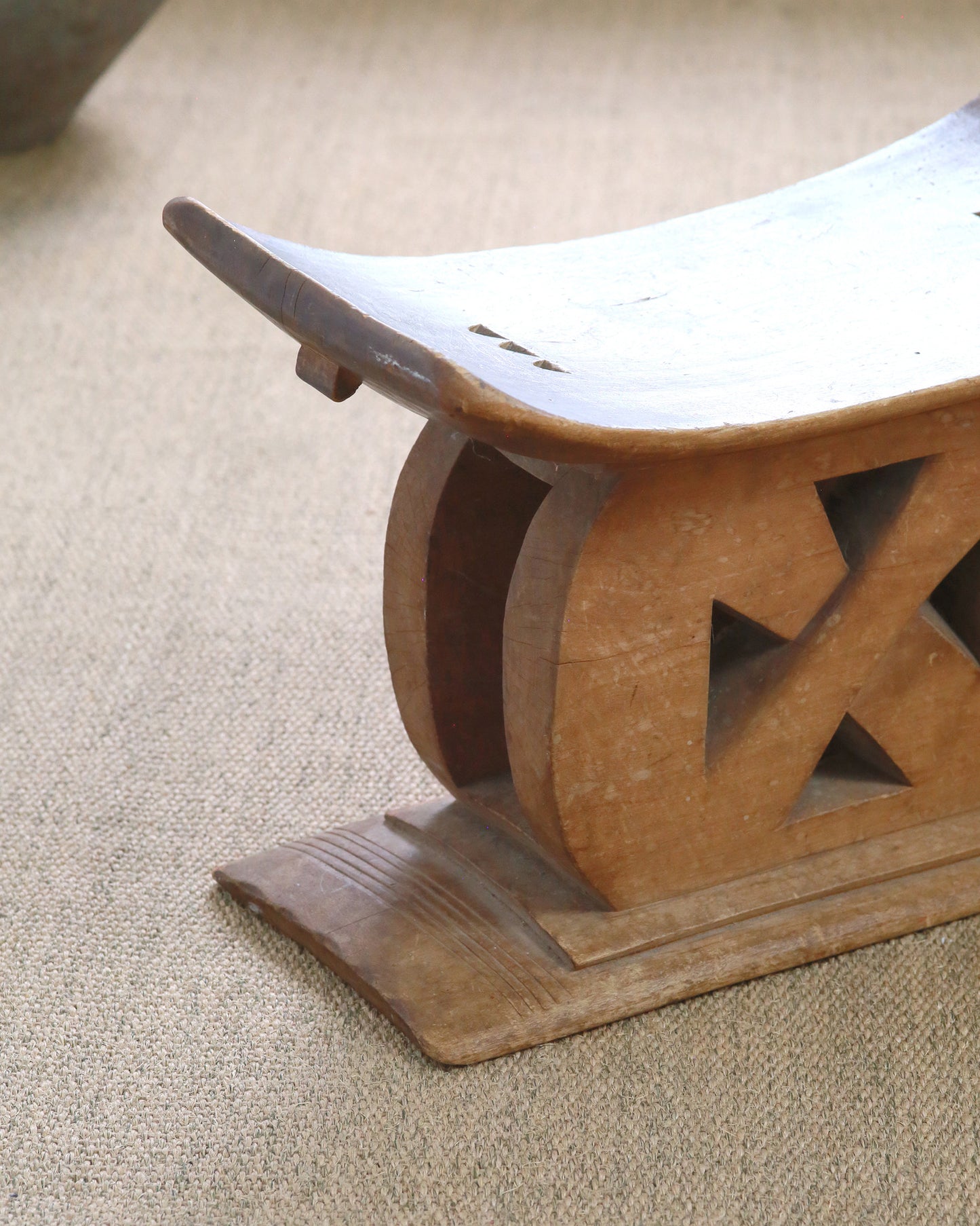 Tribal Ashanti stool on hemp rug