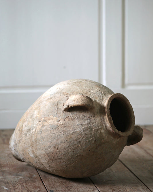 highly textured with rustic patina finish to pale antique terracotta pottery urn