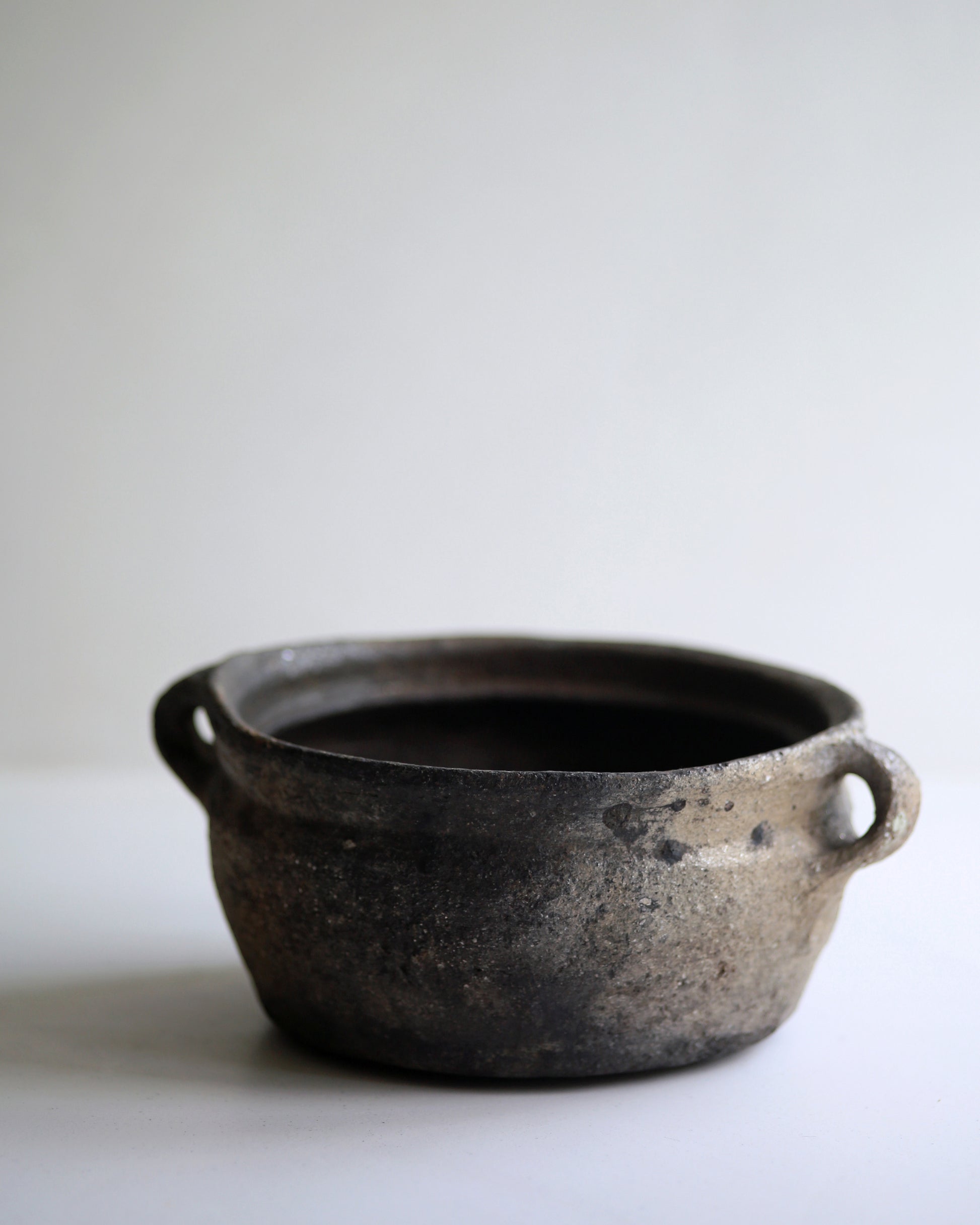 Rustic wabi sabi homeware piece, dark clay bowl with small side handles