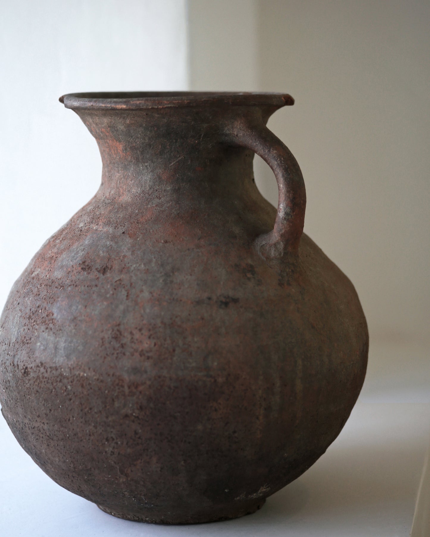 Close up of artisan made Turkish pottery piece with authentically aged terracotta patina