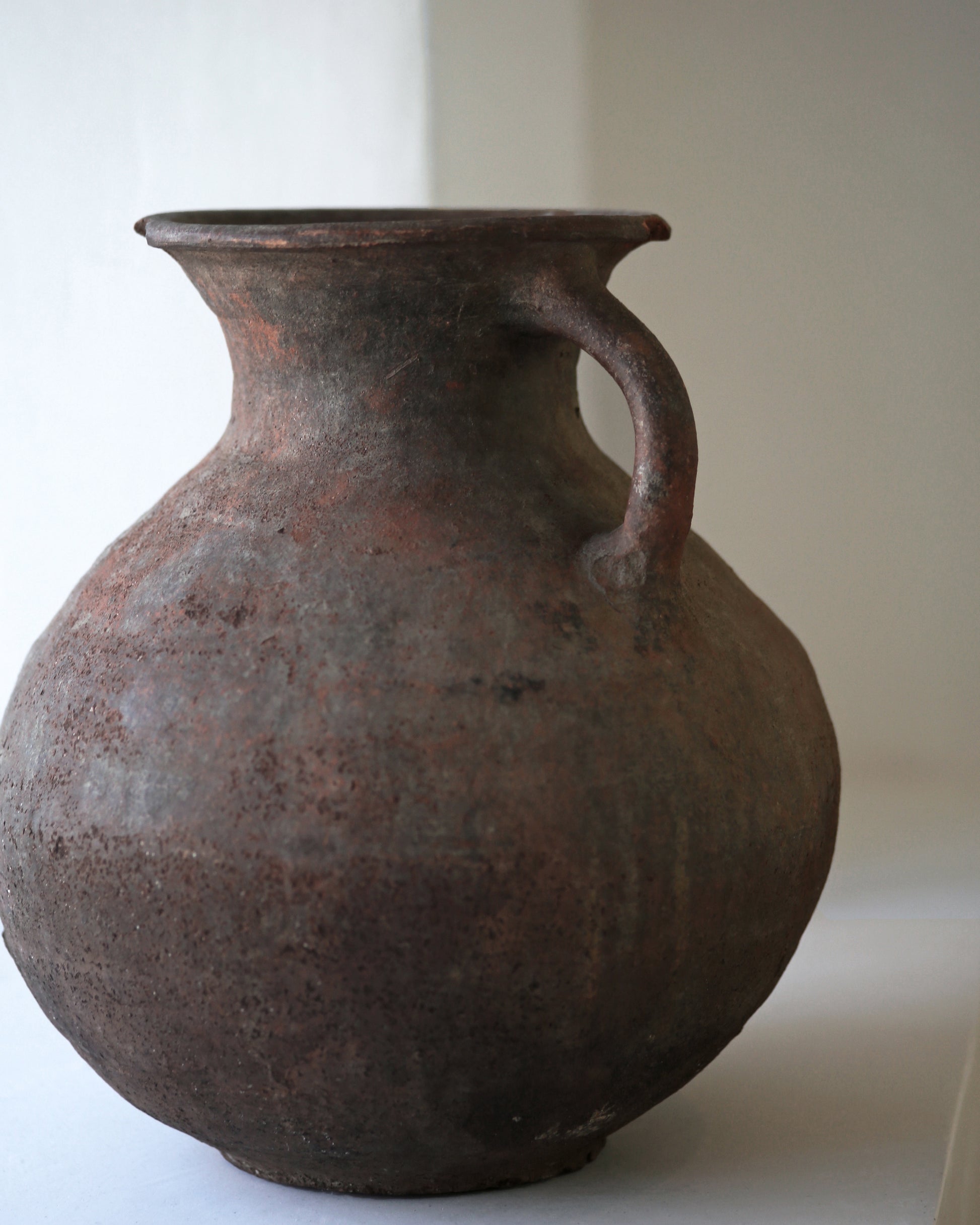 Close up of artisan made Turkish pottery piece with authentically aged terracotta patina