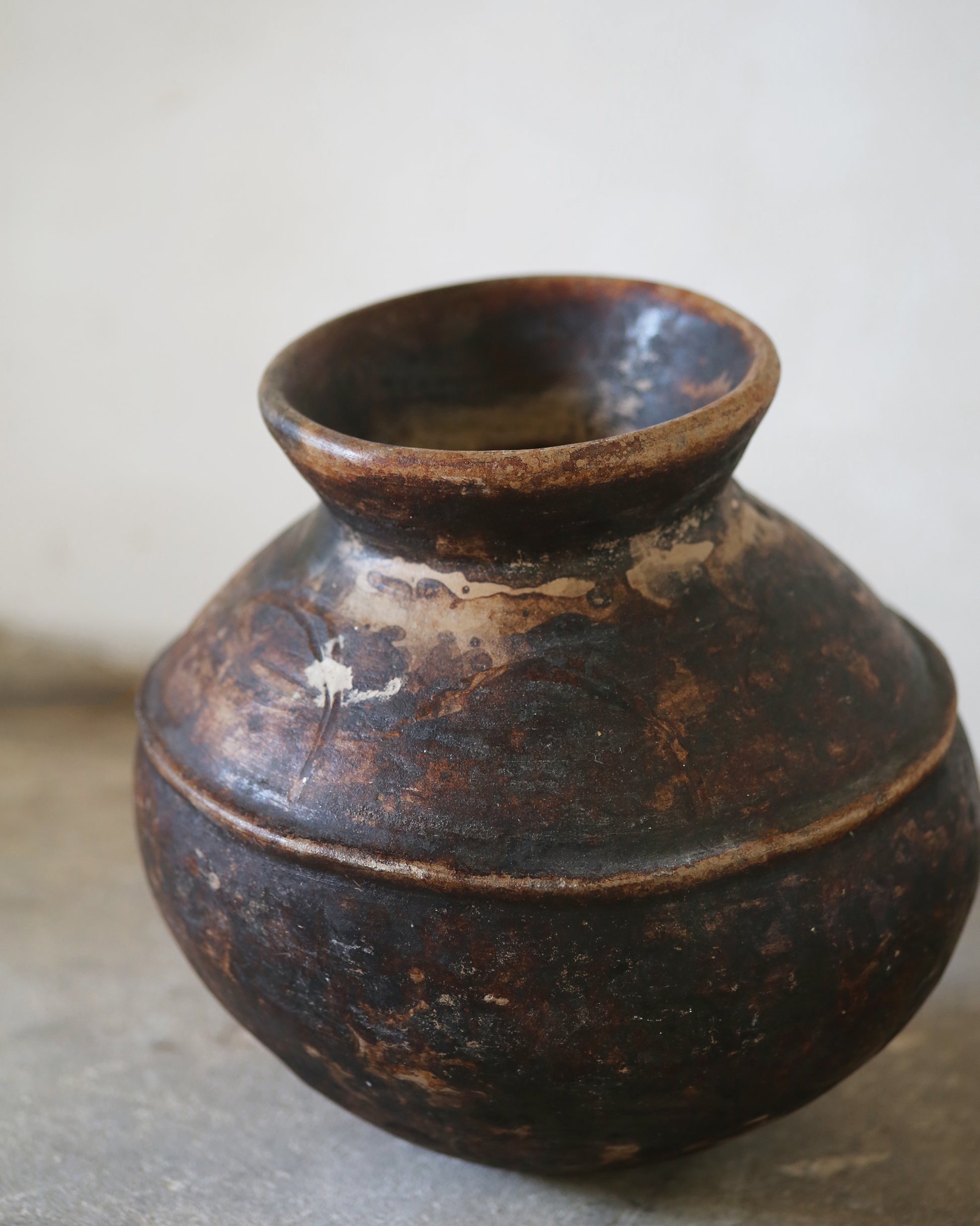 Antique African water storage pot in neutral earthy colours