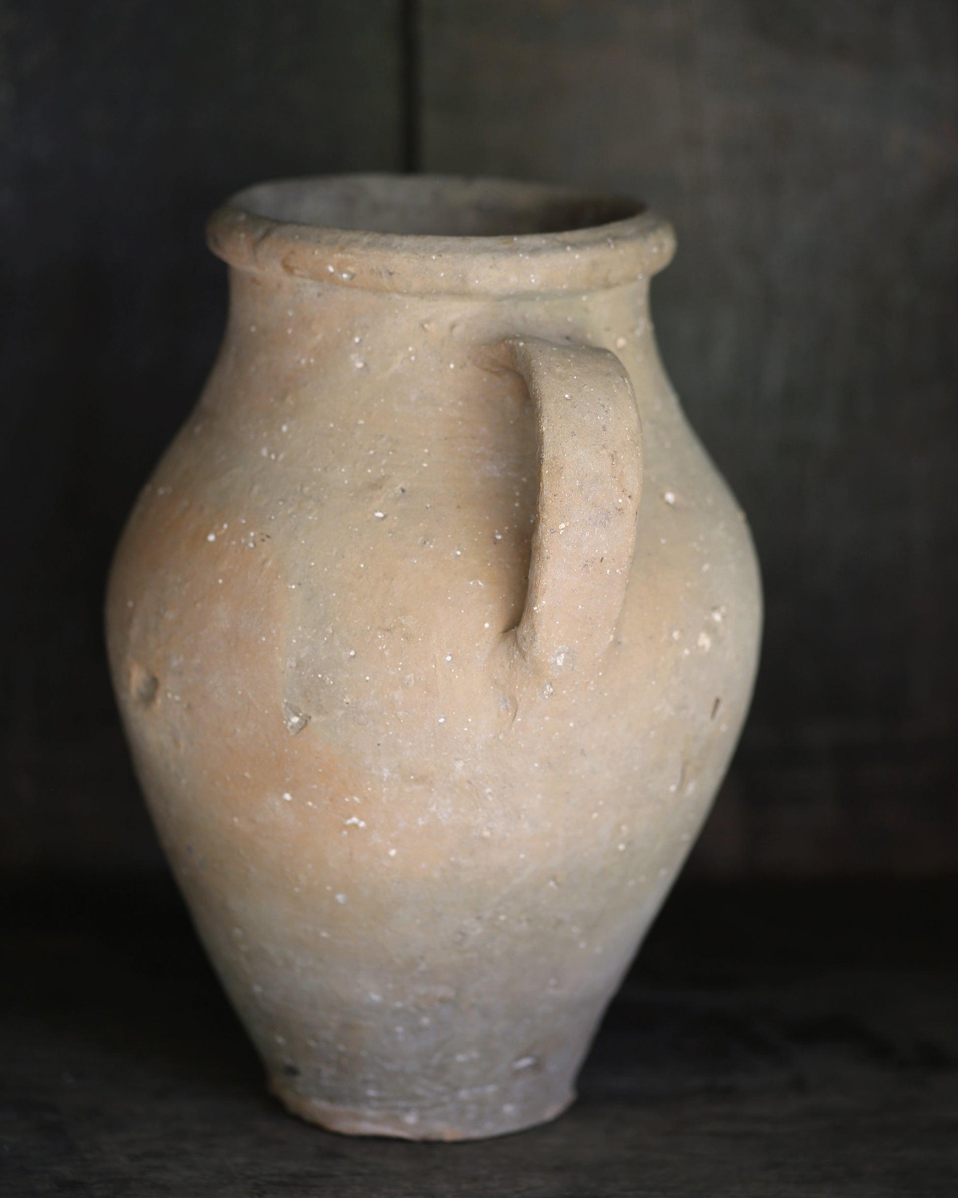 Vintage clay pot with a single handle 