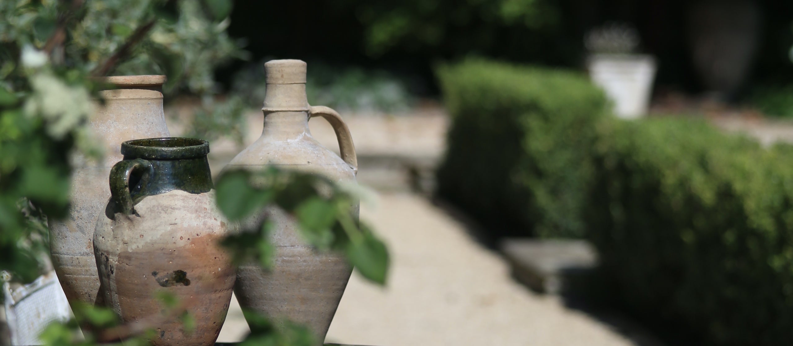 Terracotta garden decor styling on stone tabletop in English country garden