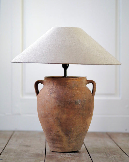 Sand toned lamp base with small handles pictured with linen lampshade