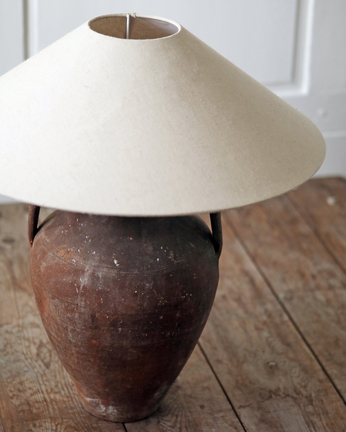 Antique pot converted to table lamp with large linen shade