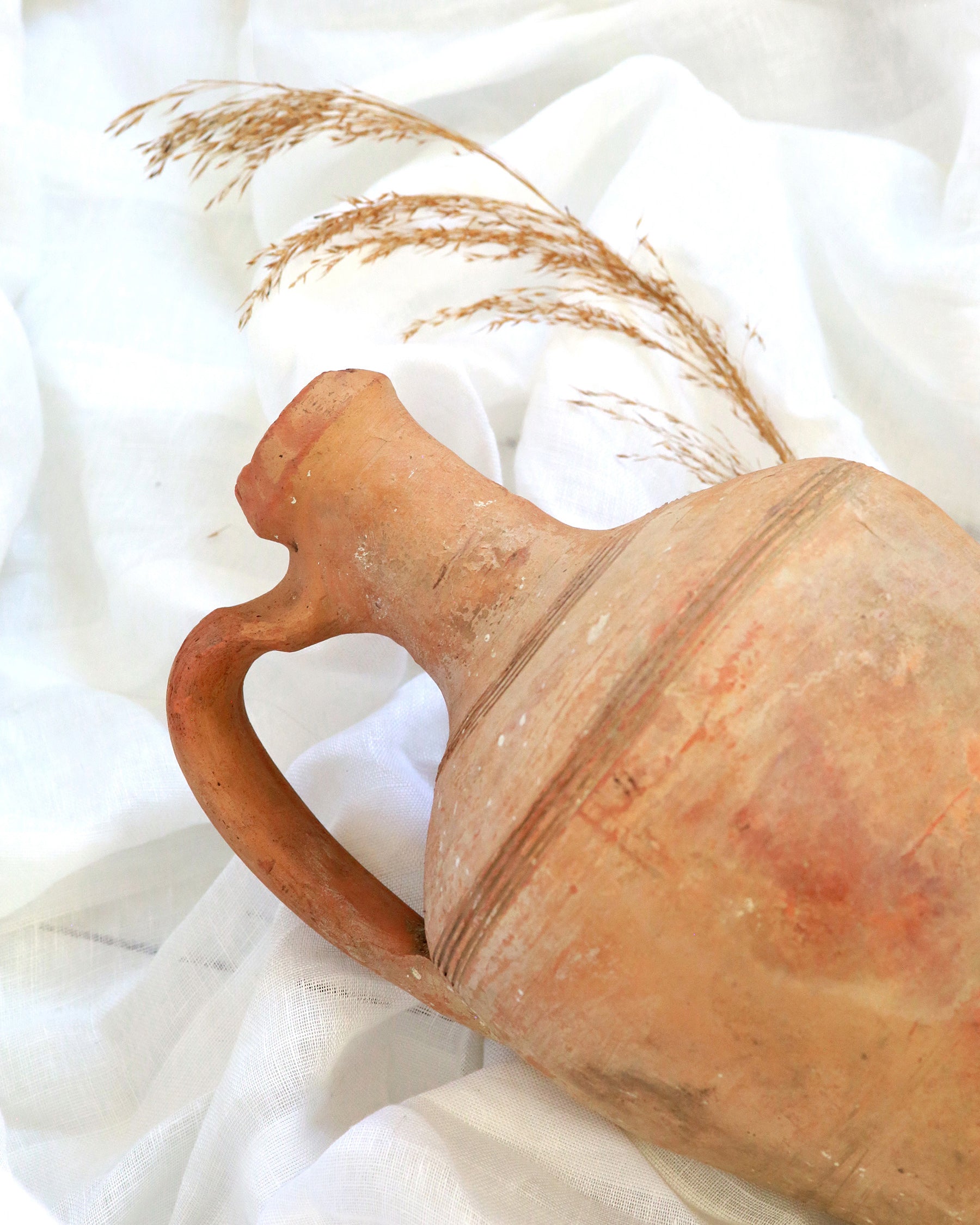 Original terracotta pot with handle and decorative stem
