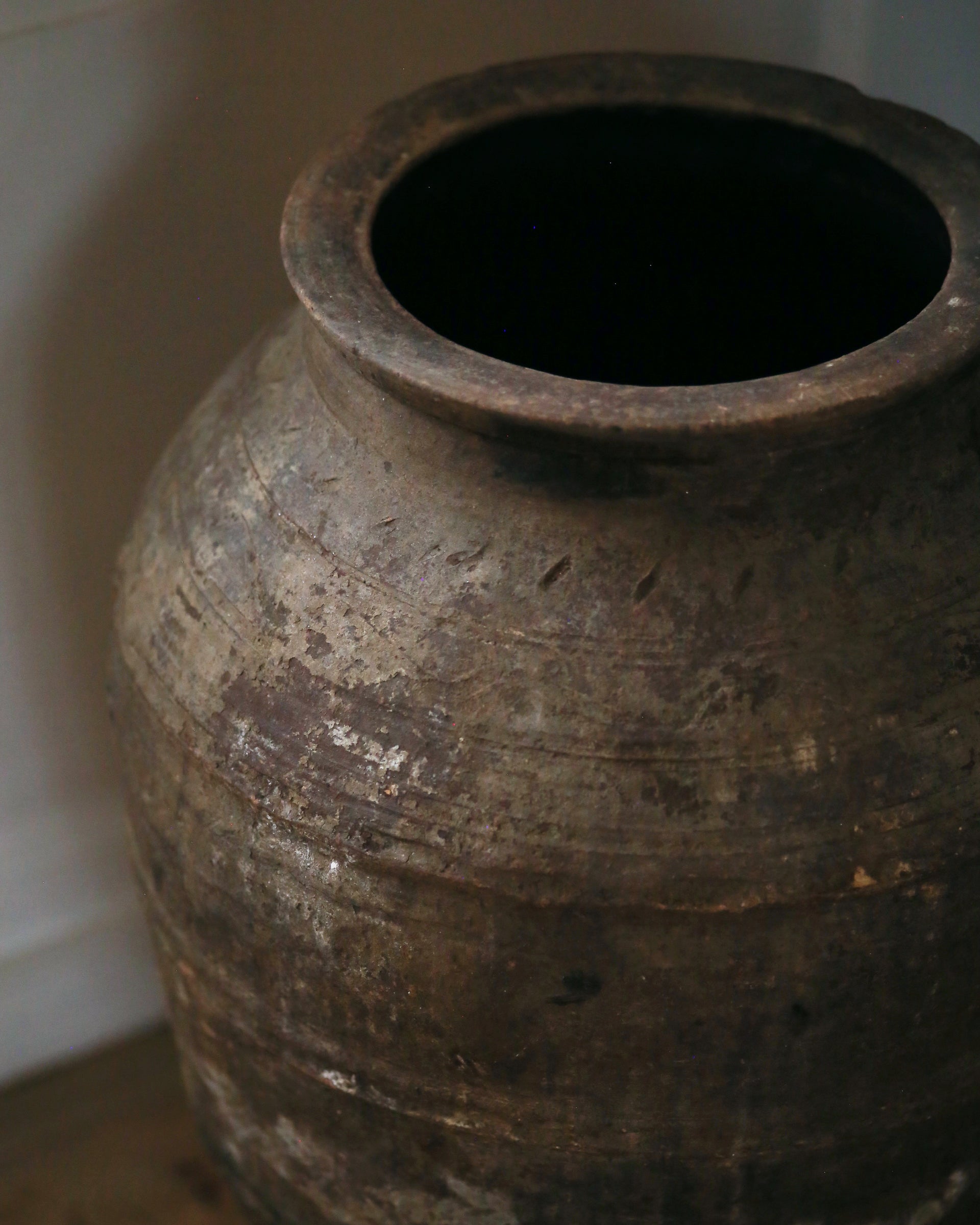 Textured detail of dark terracotta pot