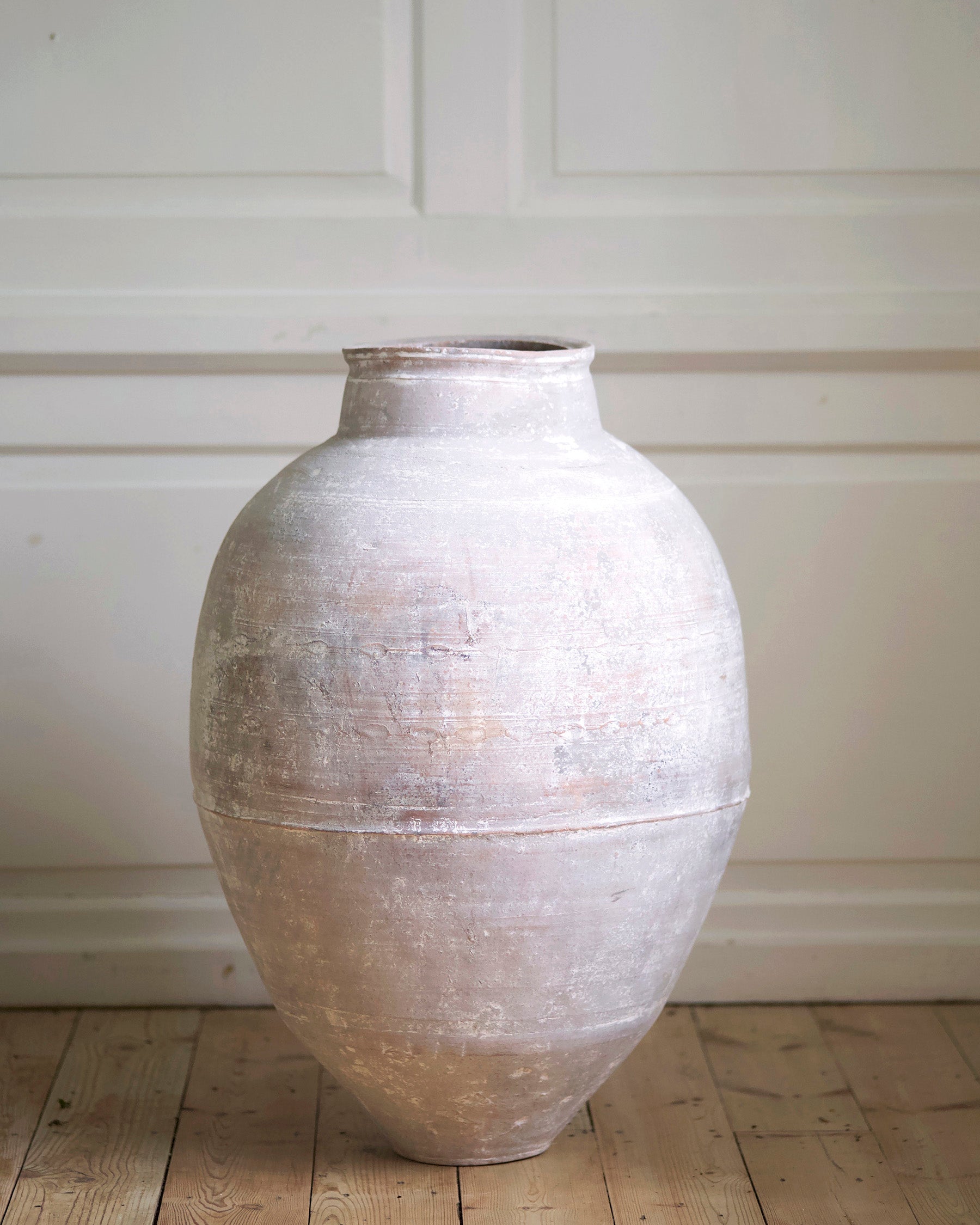 Tall white decorative urn