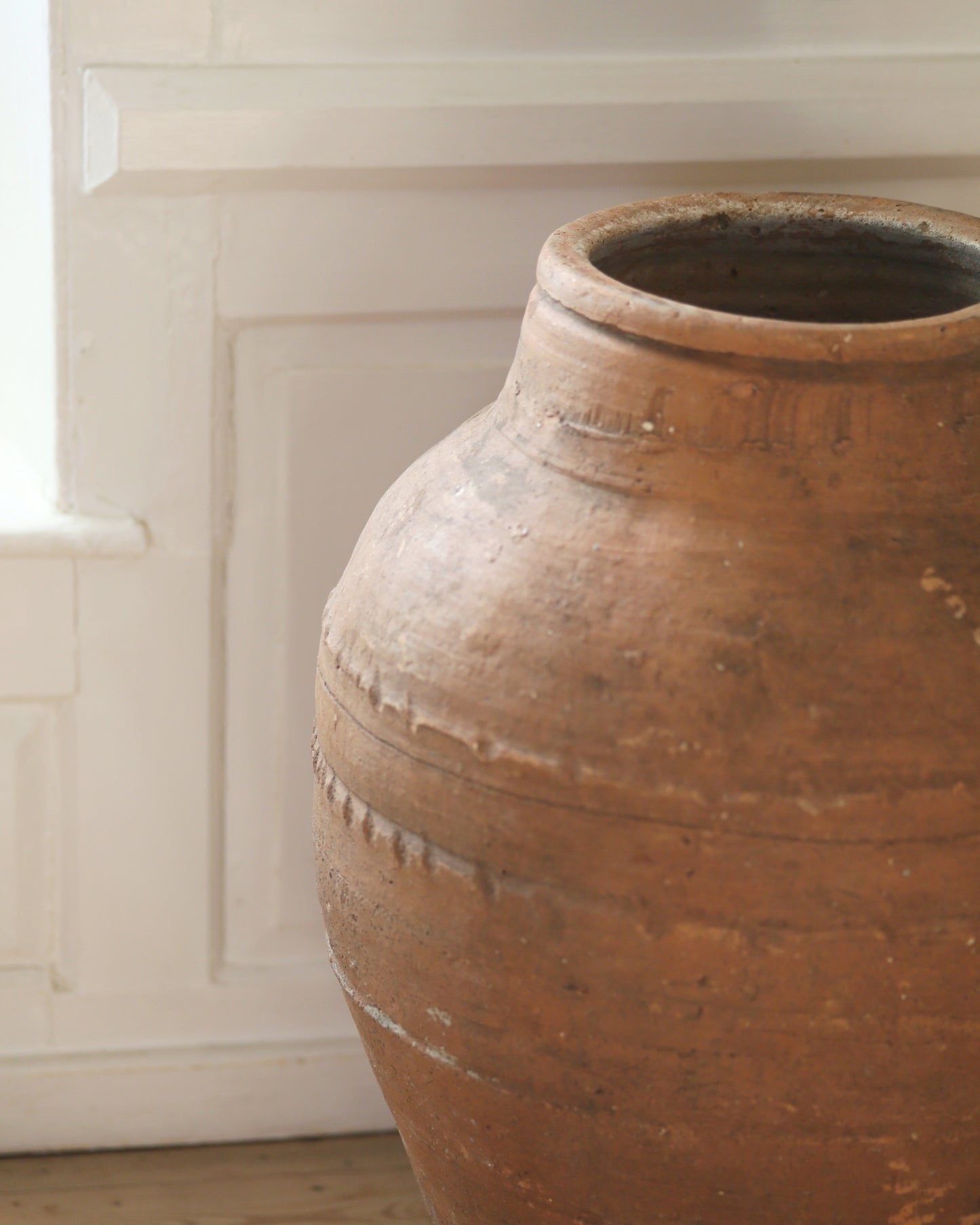 Close up of handmade artisanal rustic detail on Turkish olive pot