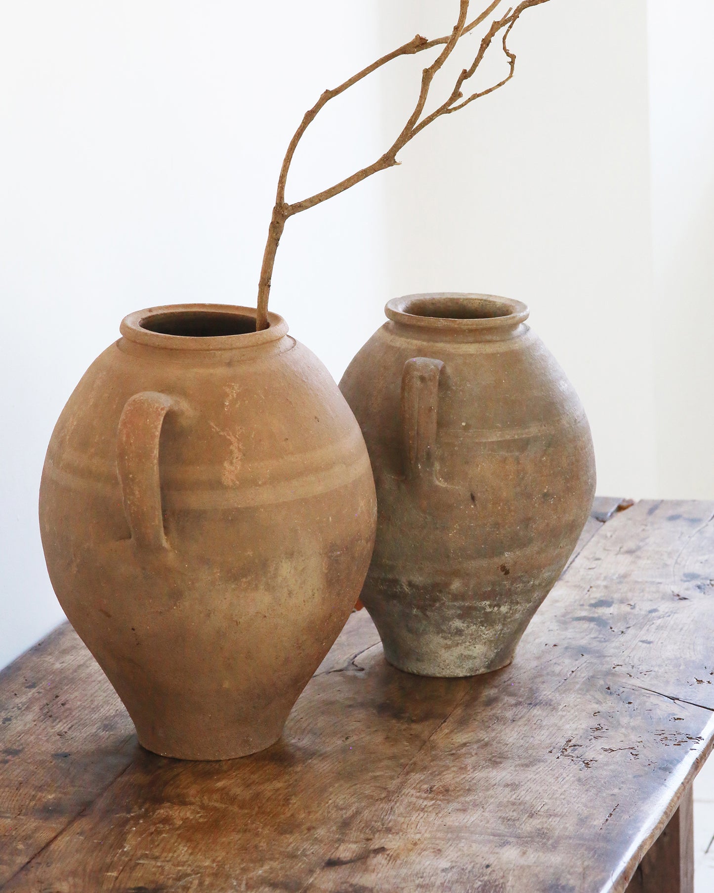 Pair of original terracotta finished pots with handles