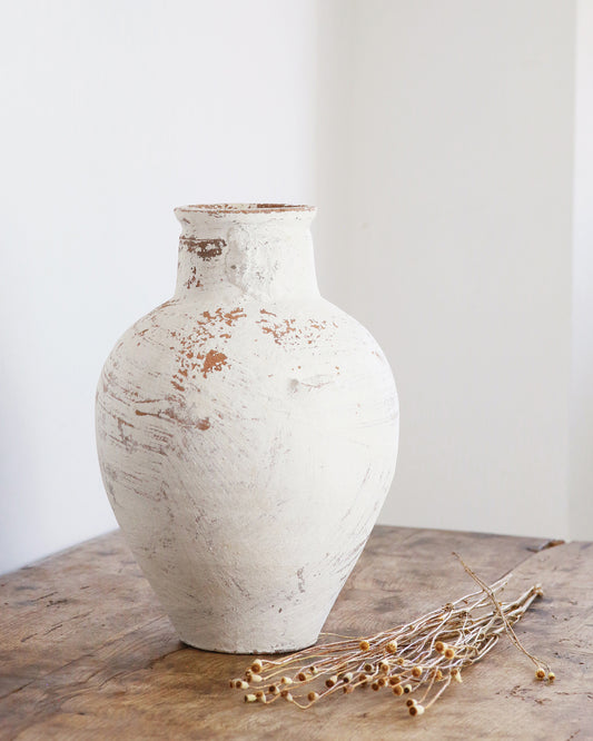Rustic white finish terracotta vase on table top