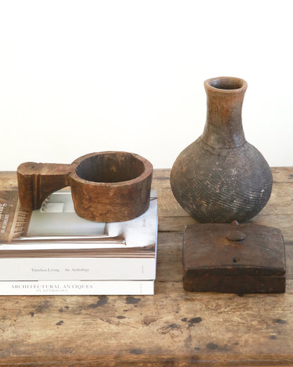 Coffee table styling of antique wooden accessories