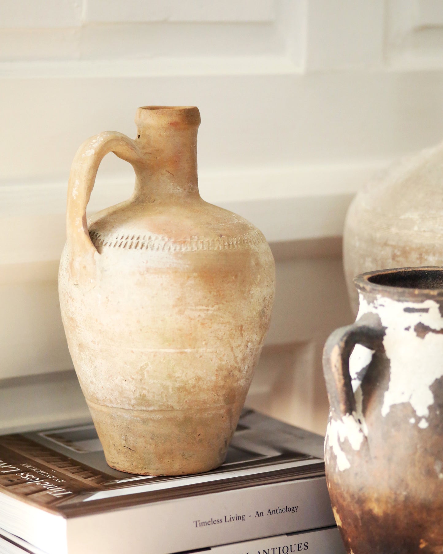 Pale terracotta antique pitcher pot