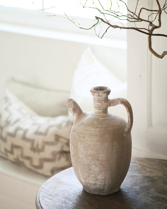 White antique jug with handle and spout