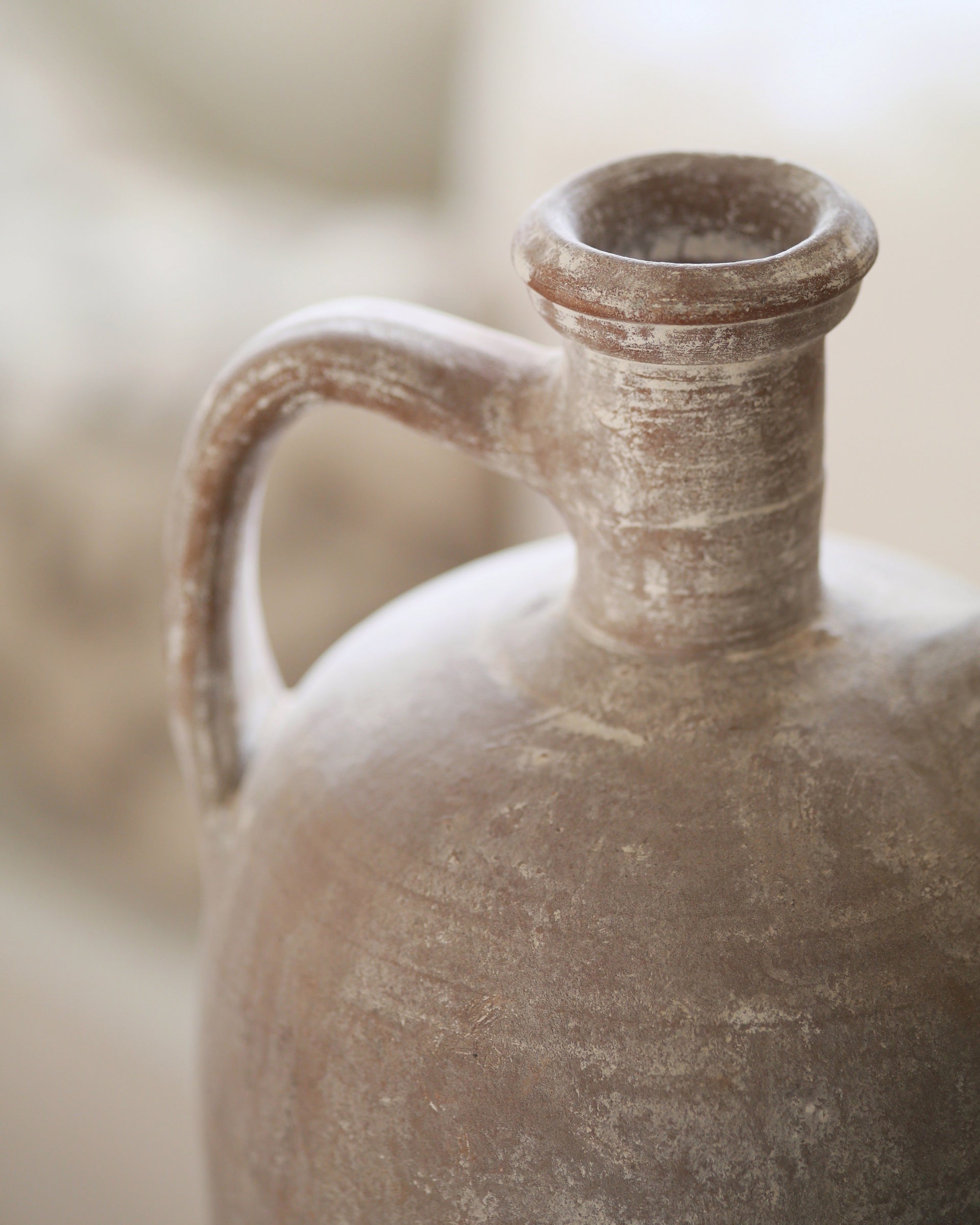 Whitewash finish of original details on terracotta jug