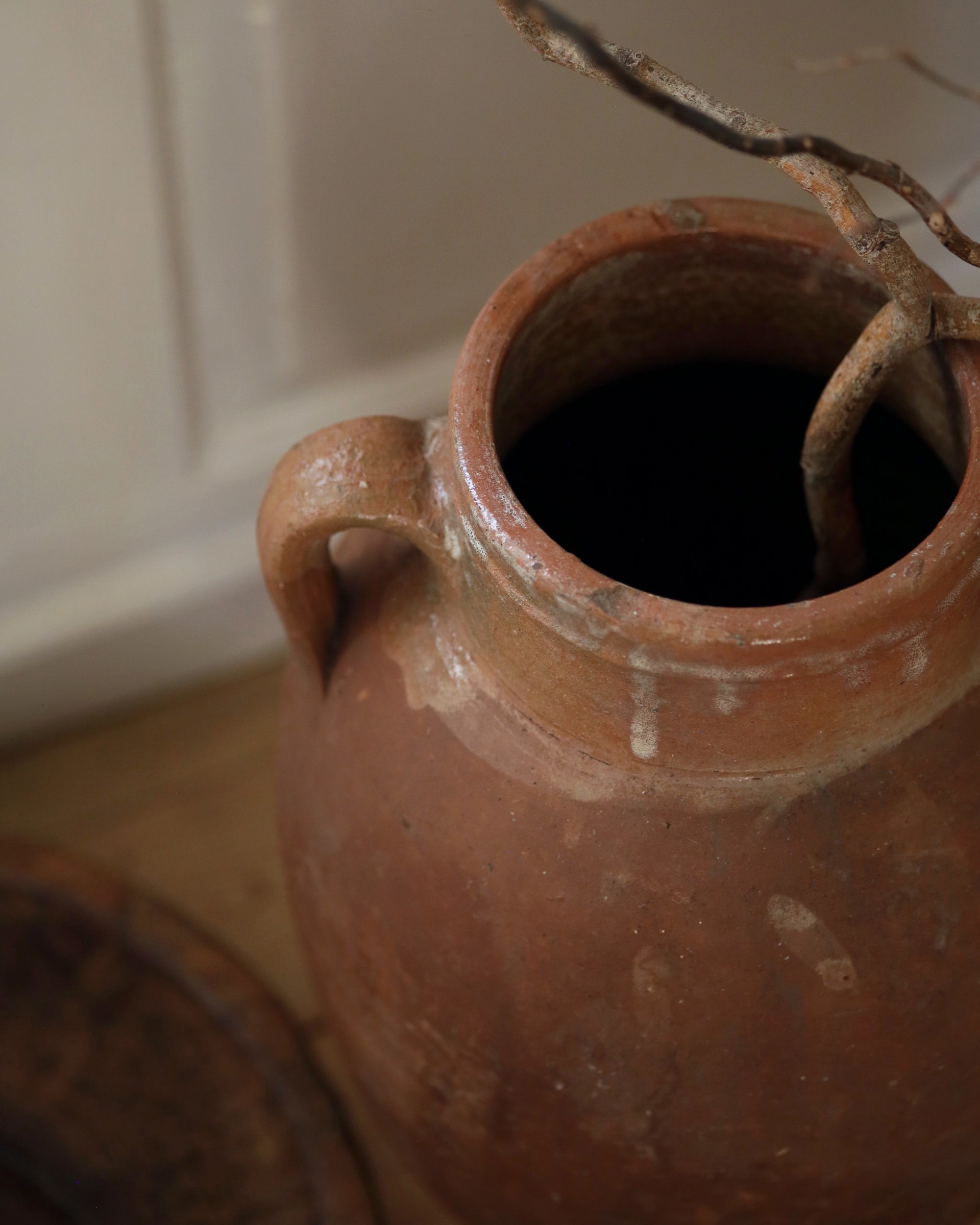 Glazed detail and handle of antique olive pot