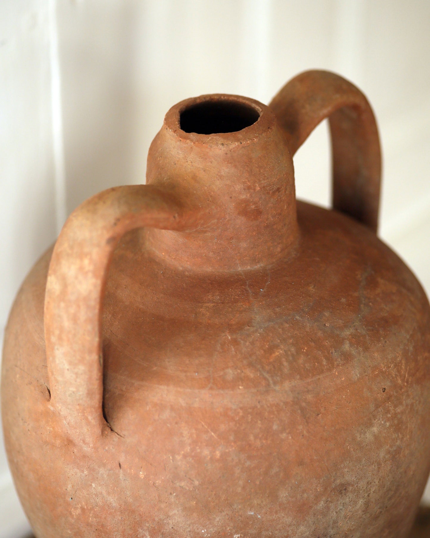 Handle detail of antique terracotta vase