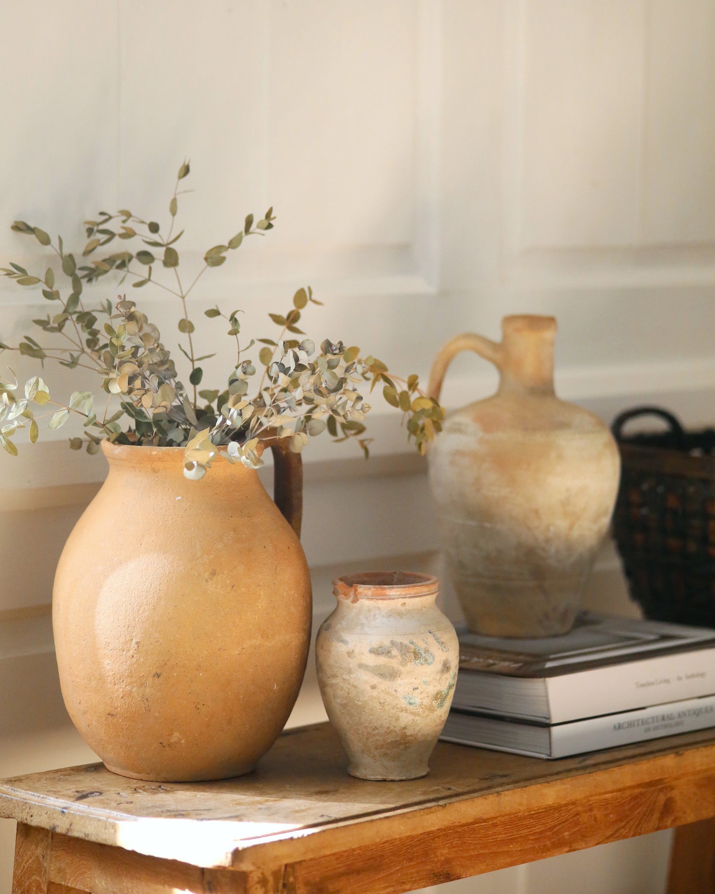 Curated collection of antique clay pots and vases