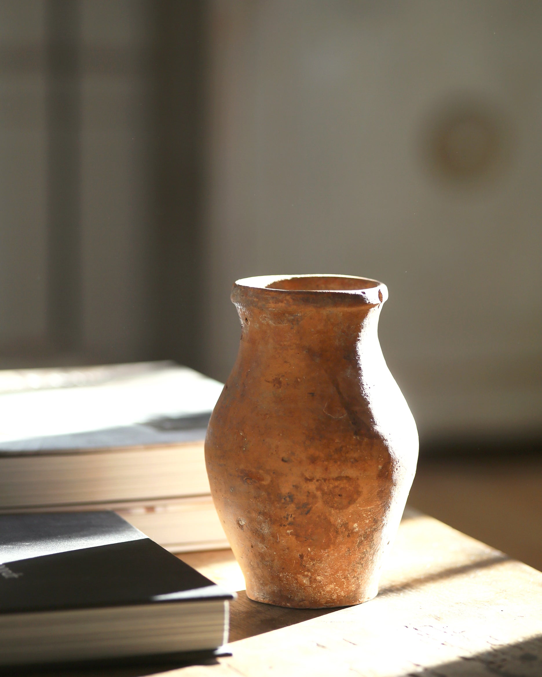Small vintage clay vase for display