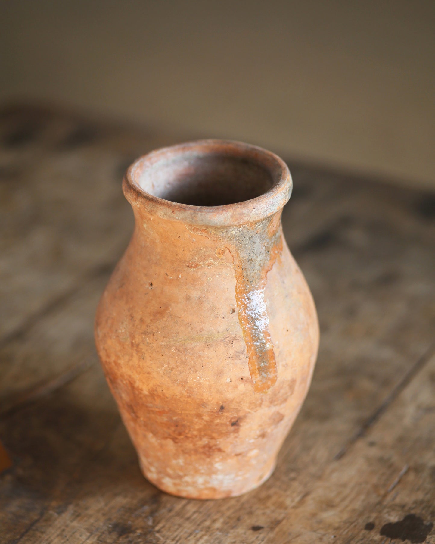 Original glazed detail on small terracotta pot