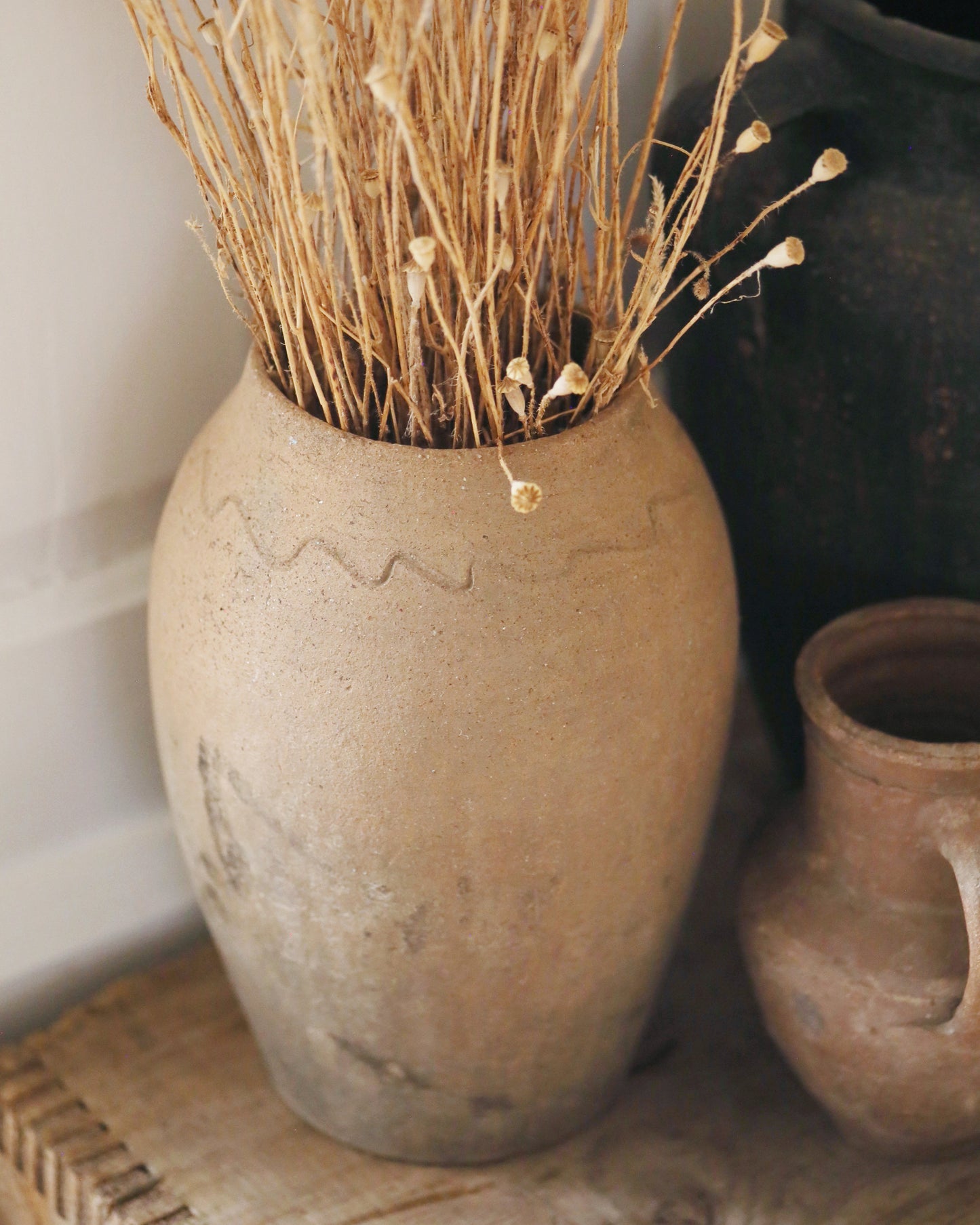 Close up of artisanal detail on traditional Mediterranean terracotta pot 