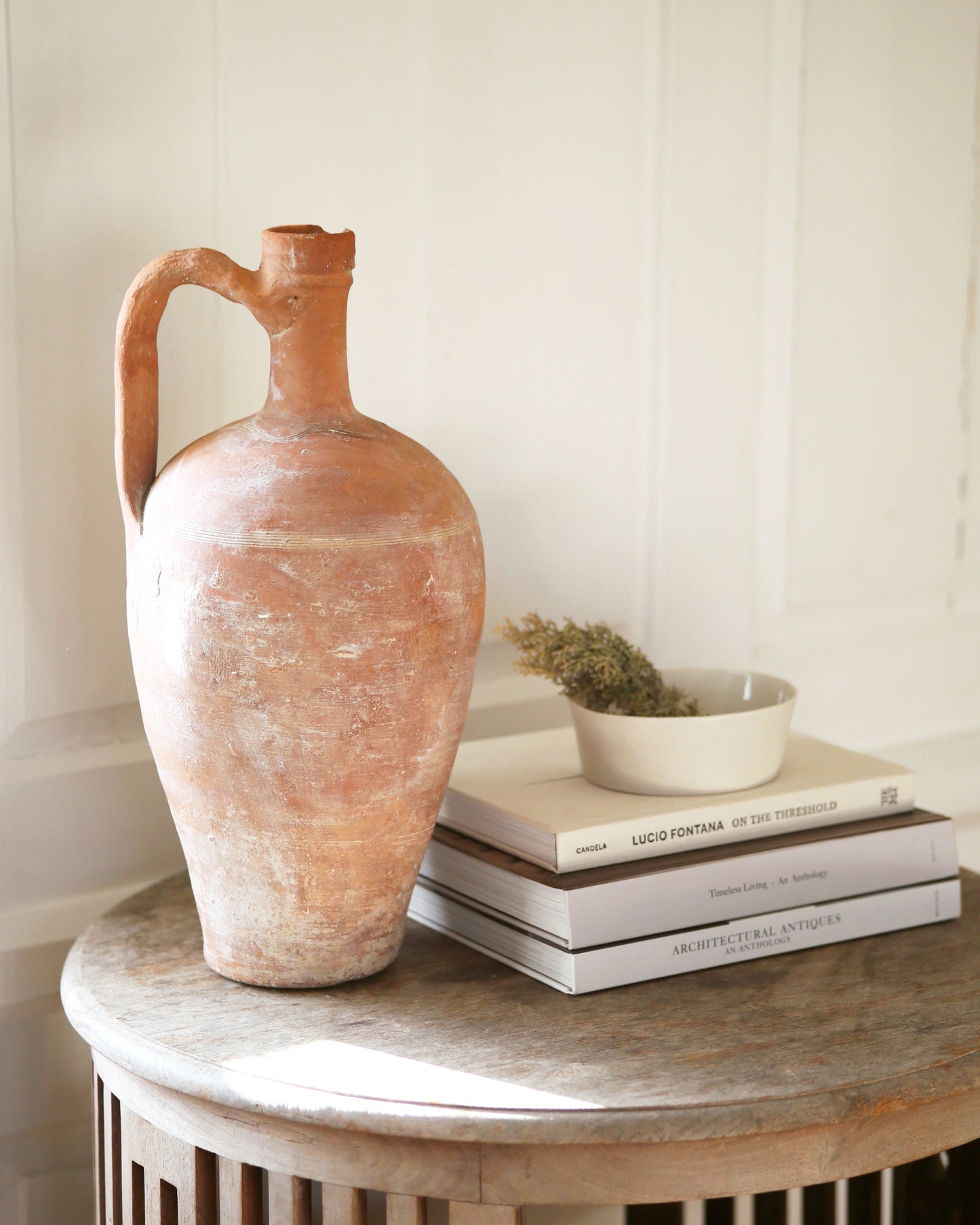 Tall terracotta pitcher jug for decorative display