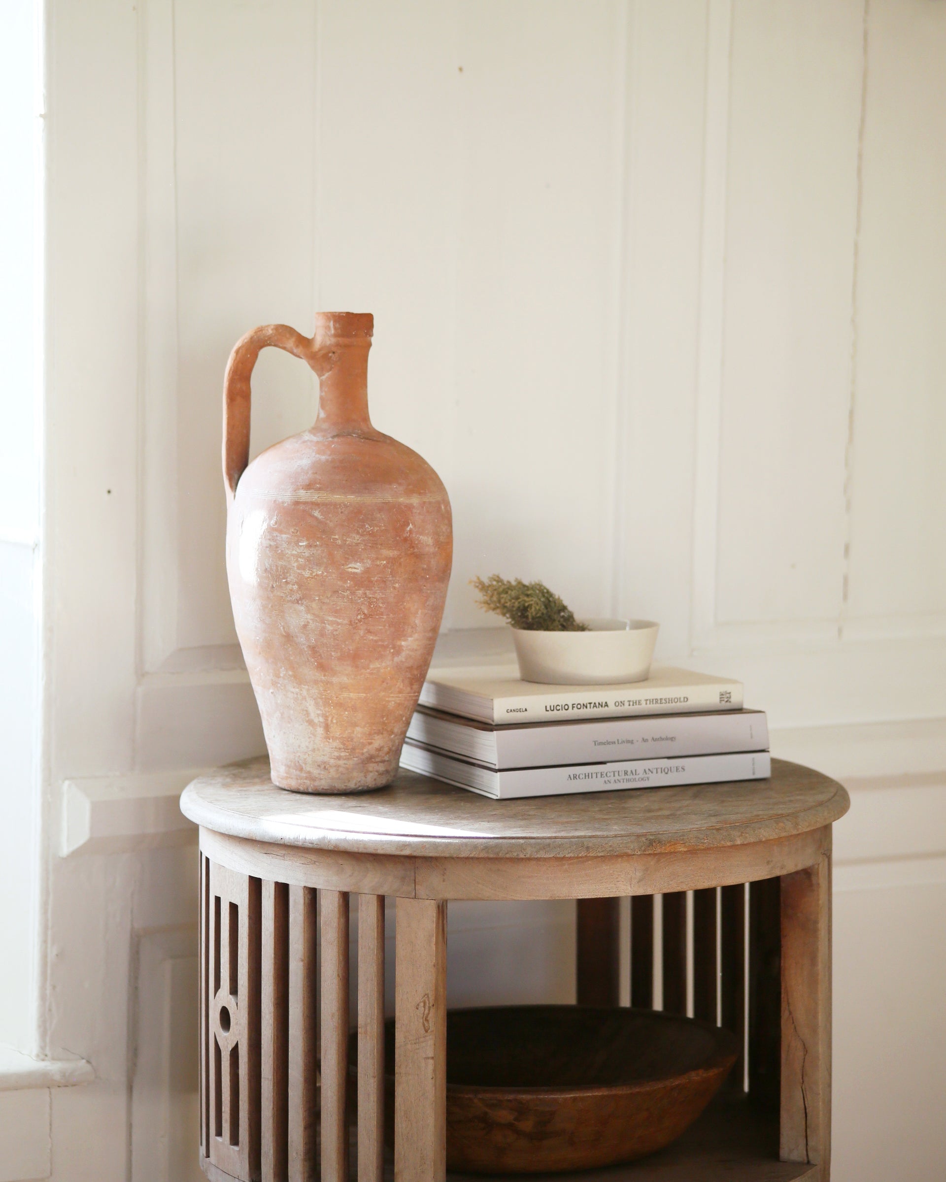 Occasional table with antique pottery