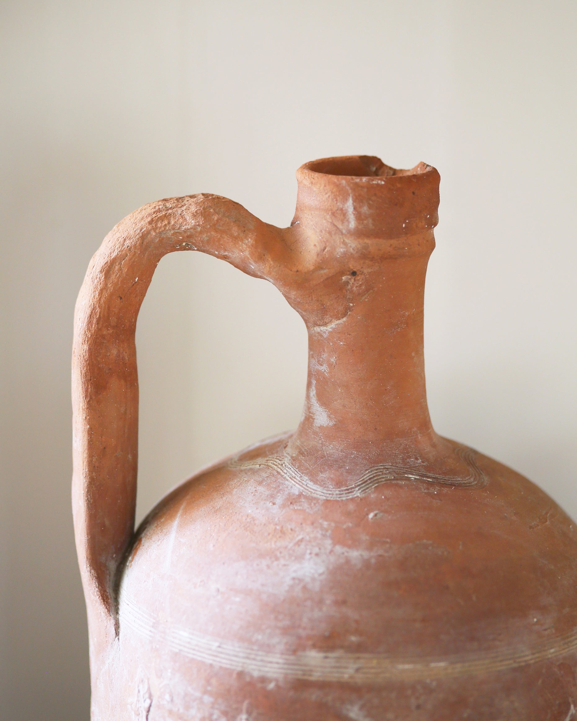 Terracotta finish to vintage Turkish pot