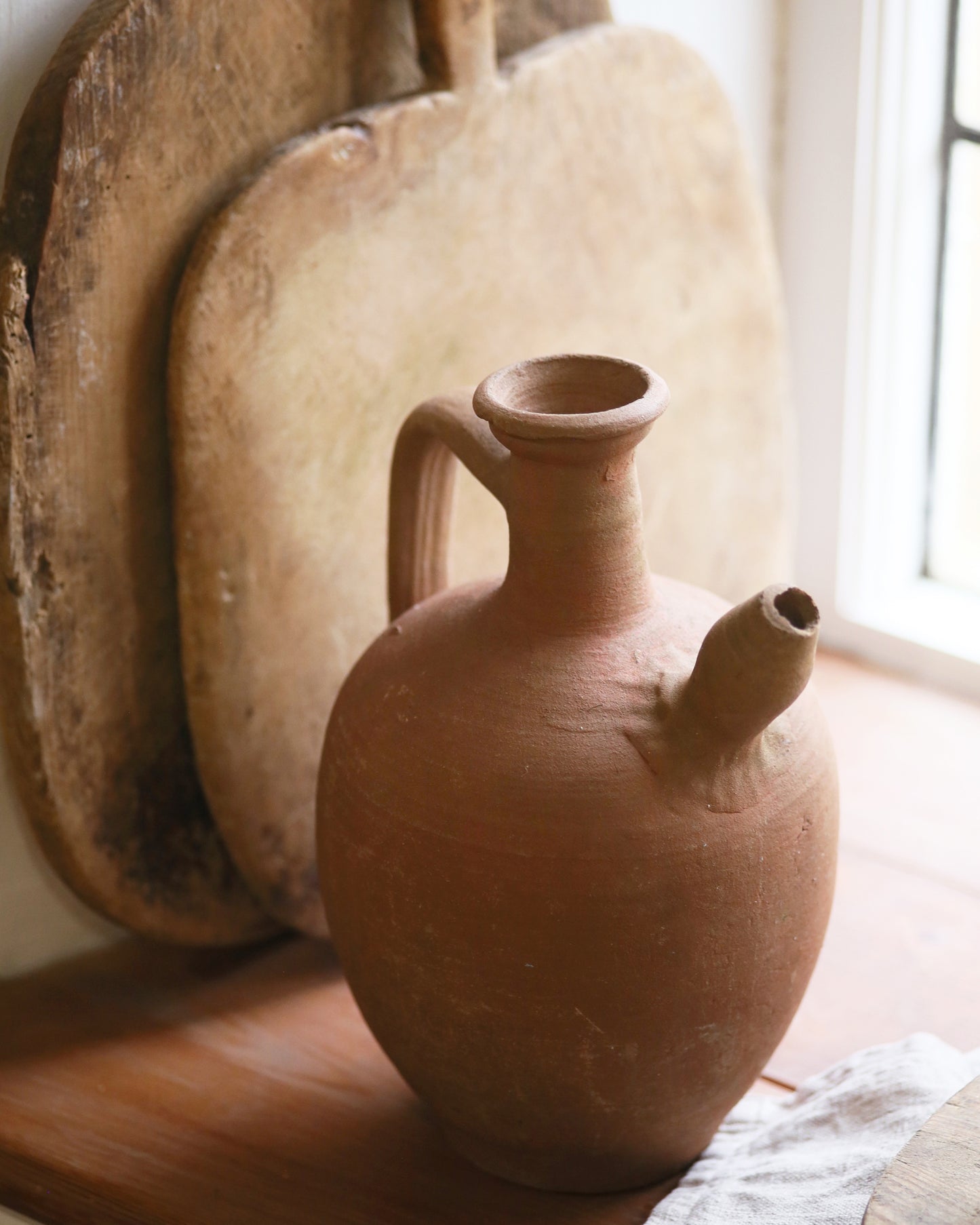 Close up of original terracotta spouted pot