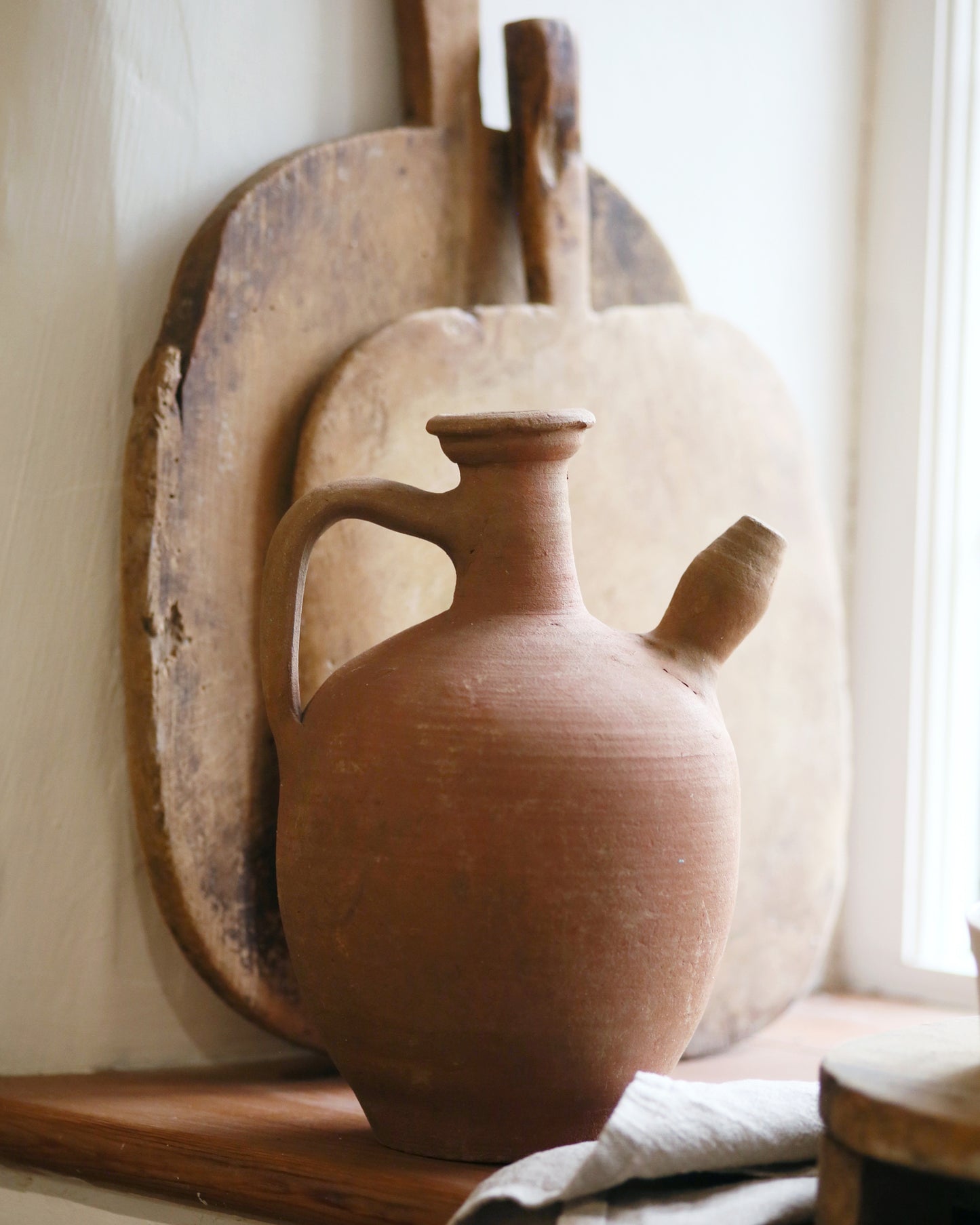 Vintage Mediterranean clay jug with pouring spout