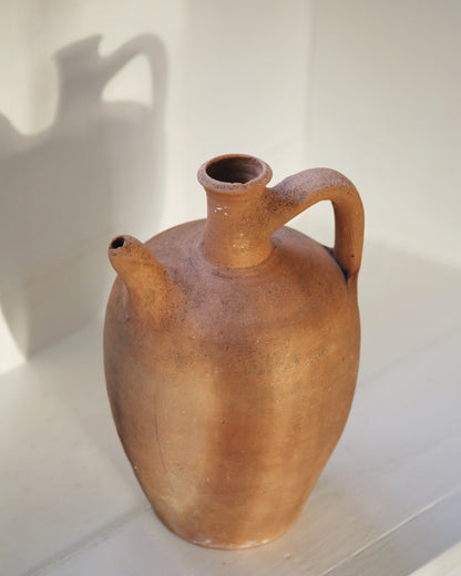 Antique pot with spout