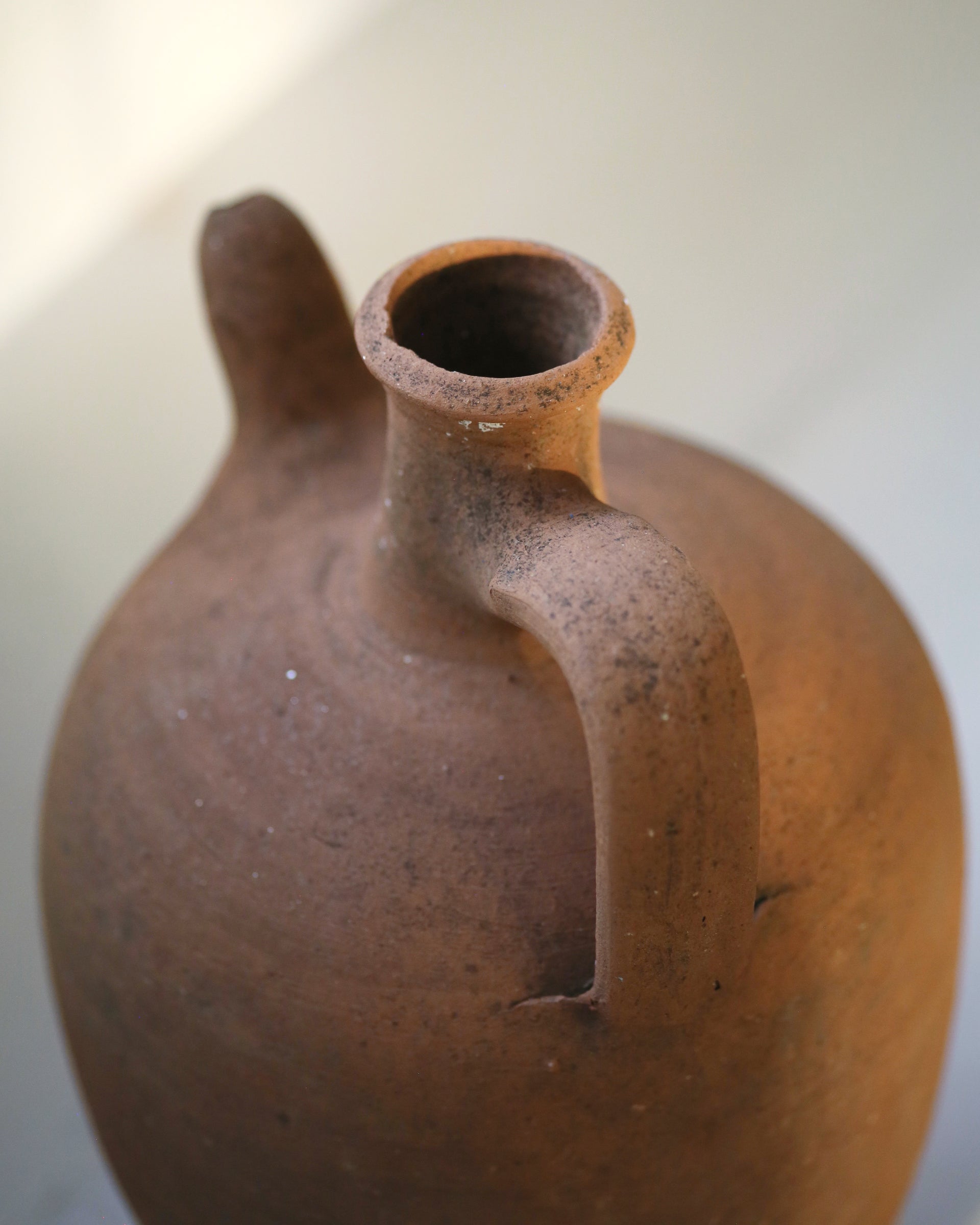 Naturally aged patina of antique clay jug