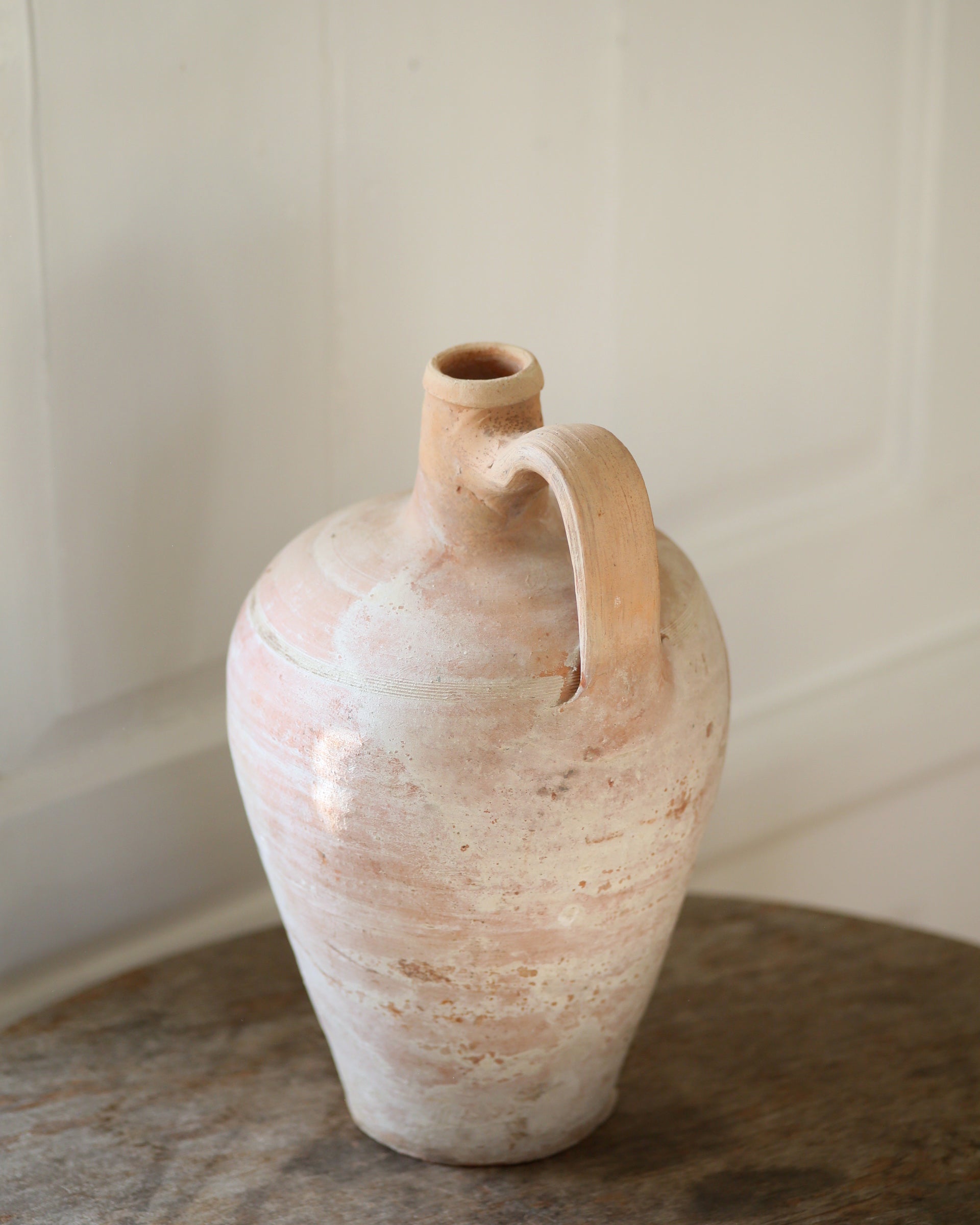 Pale terracotta antique pot with handle