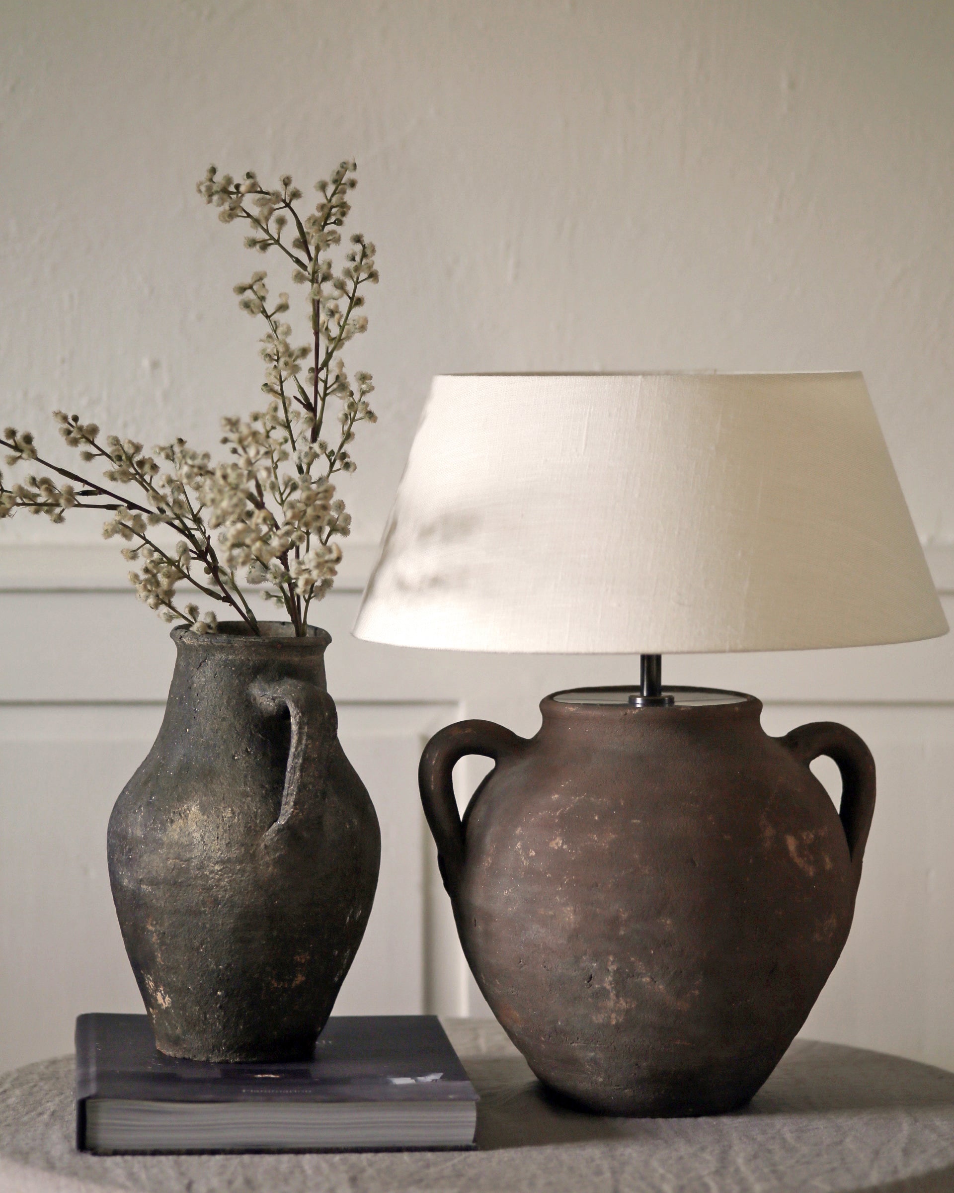 Dark earthy toned antique pots converted to table lamp