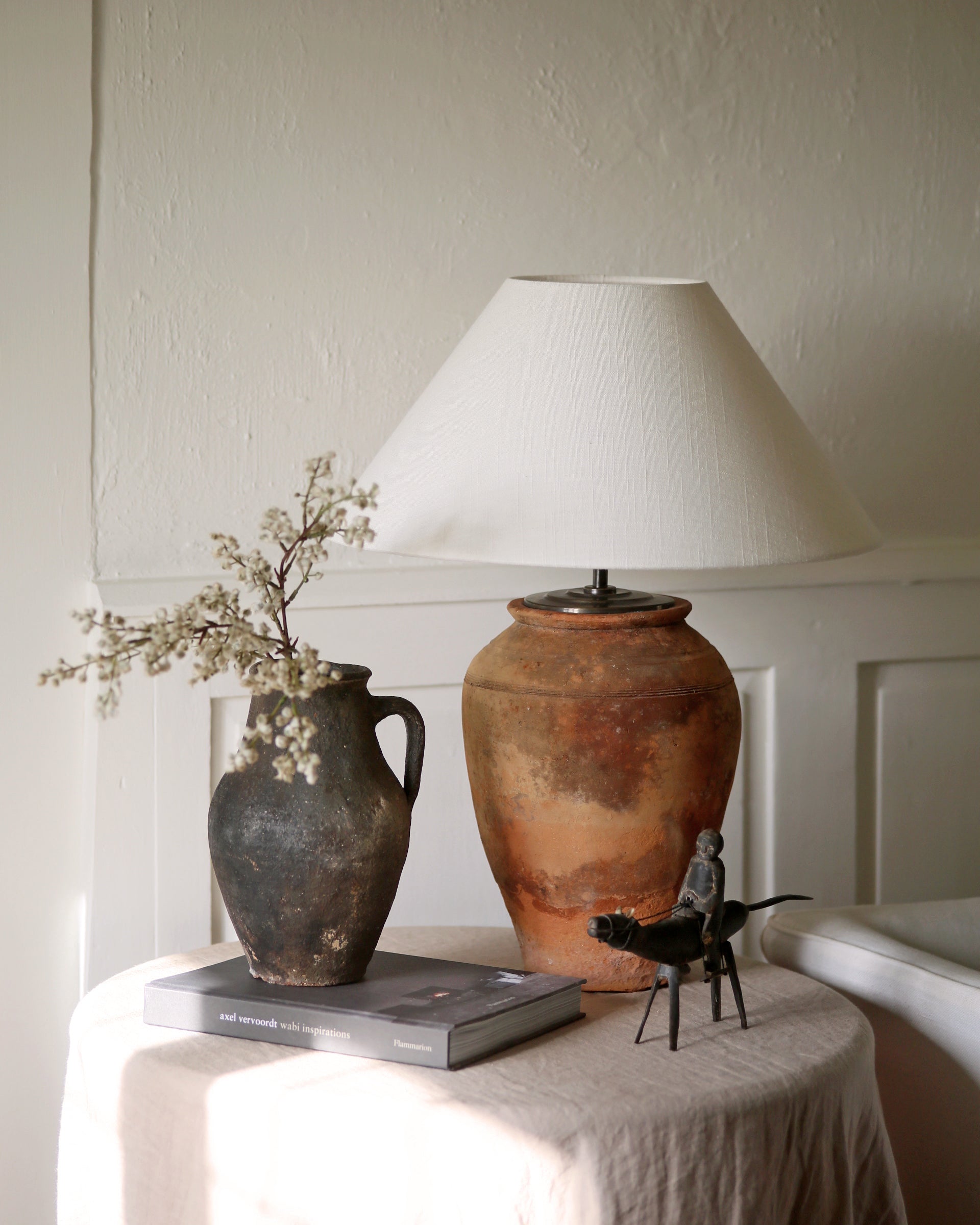 Antique terracotta clay table lamp styled with antique homewares