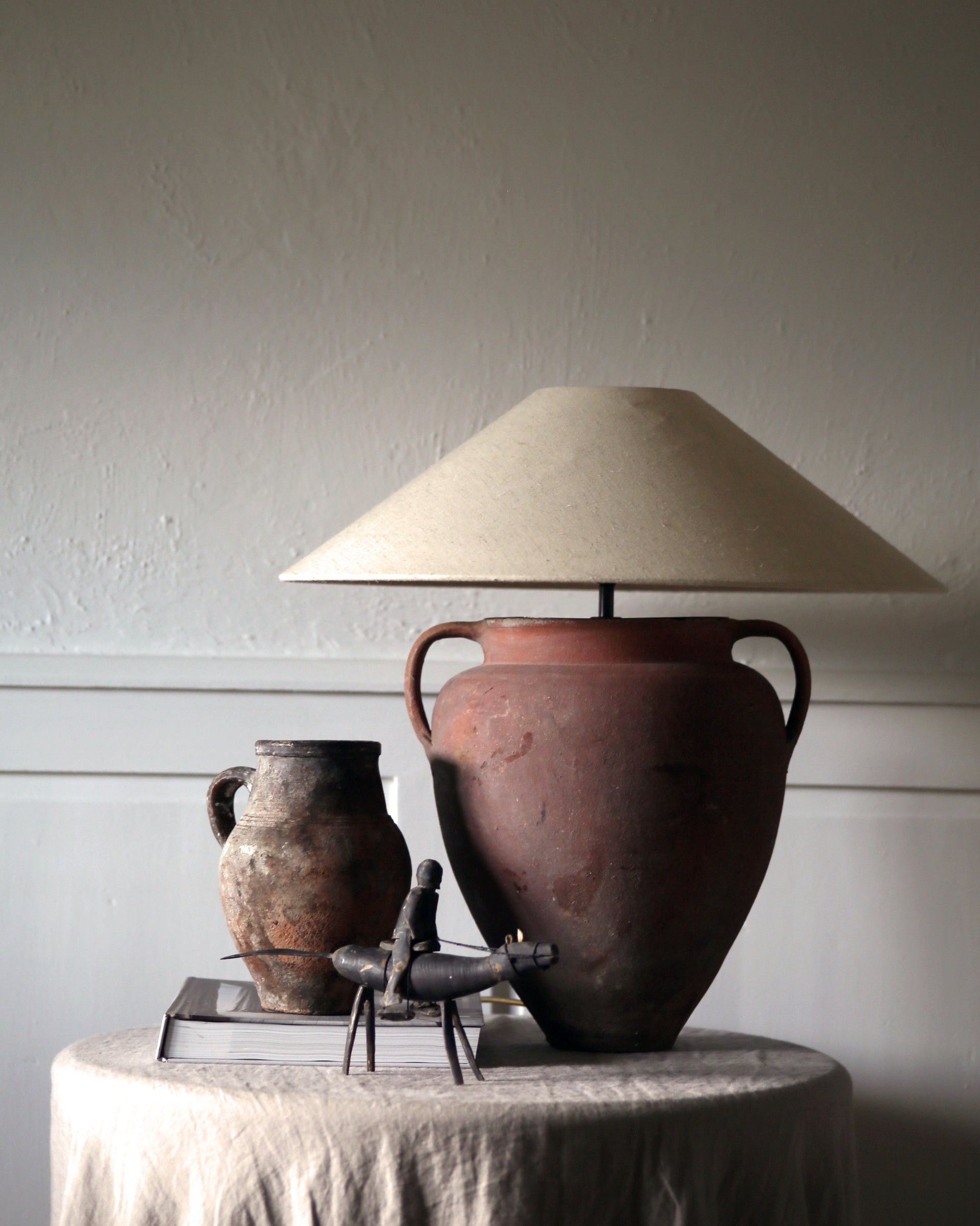 Statement antique vessel olive pot lamp with wide linen shade