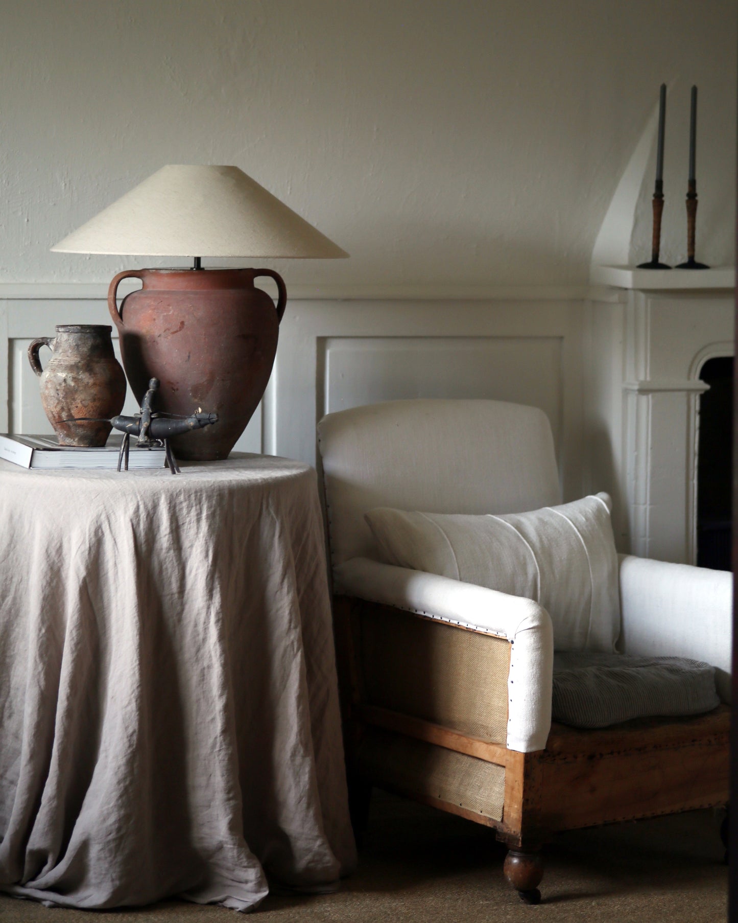 Statement antique lamp in farmhouse with antique furniture and homewares