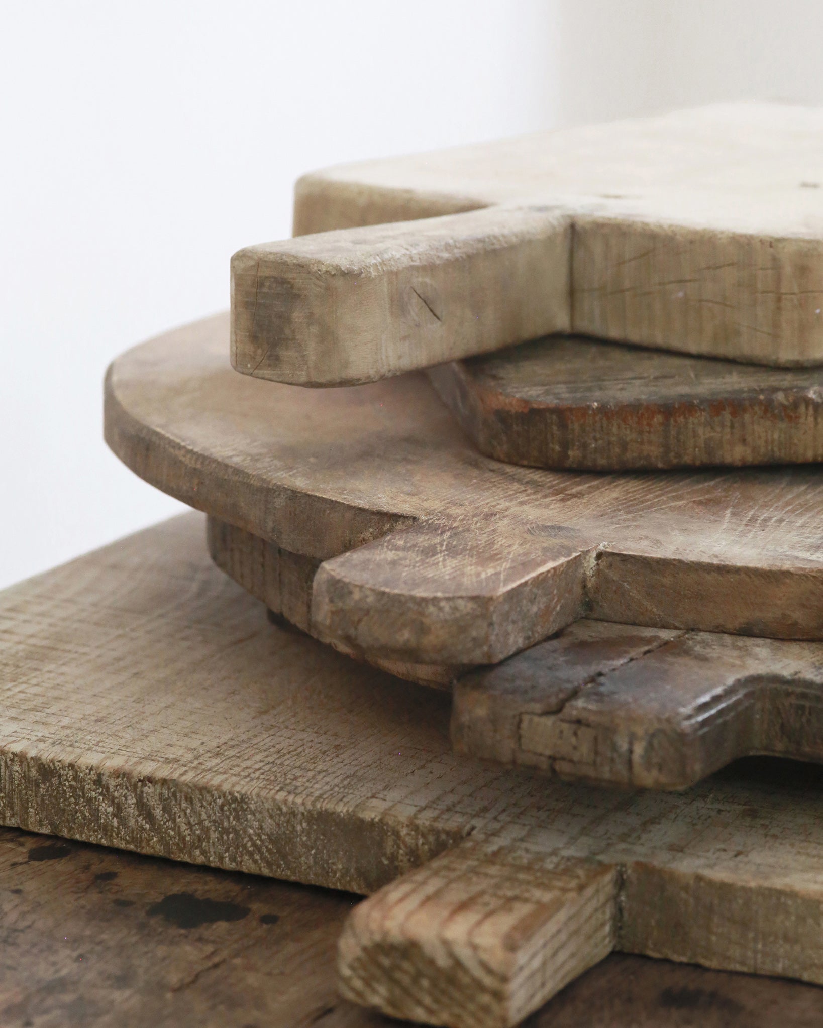Stacked wooden chopping boards on worktop