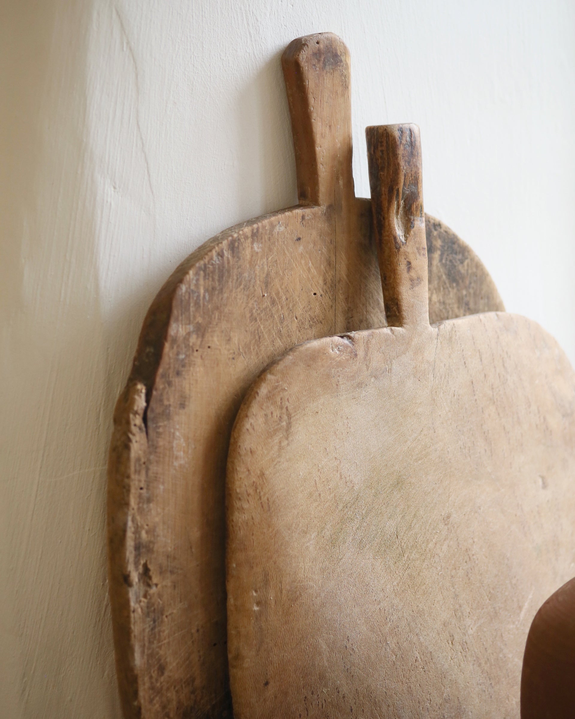 Stacked antique vintage bread boards