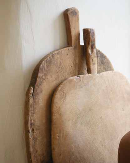 Stacked antique vintage bread boards