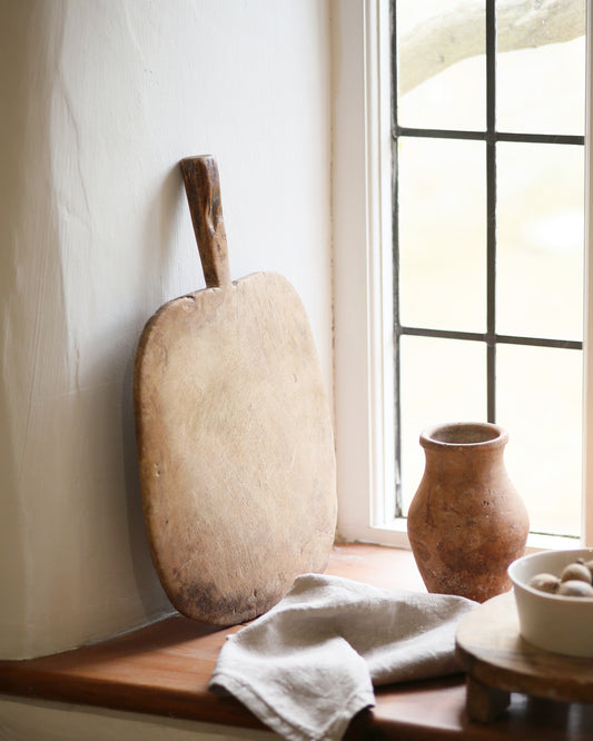 Authentic vintage wooden chopping board with rustic detail