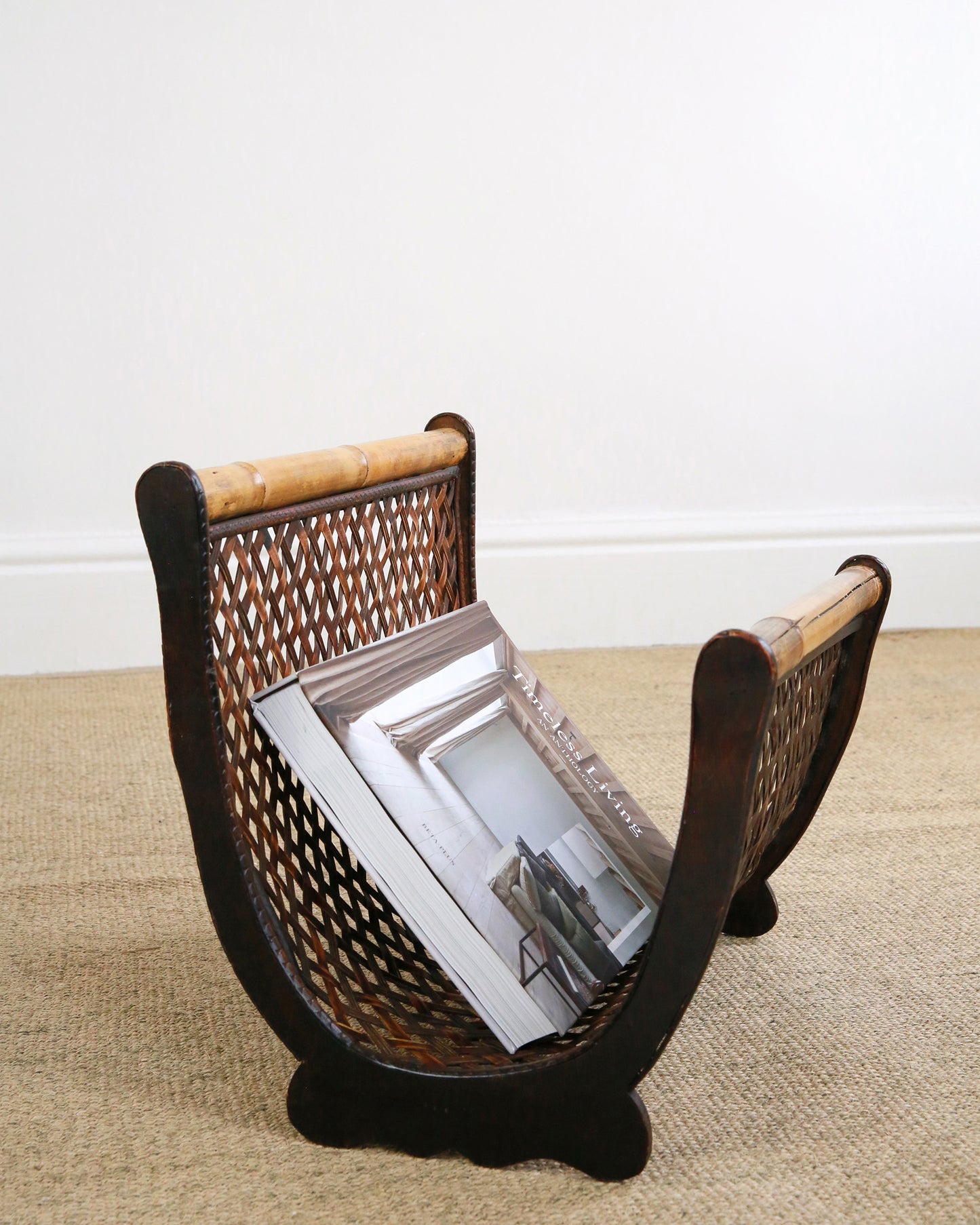 Vintage magazine rack styled with interiors book