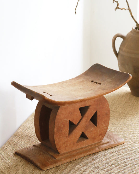 Ashanti stool sat on hemp rug